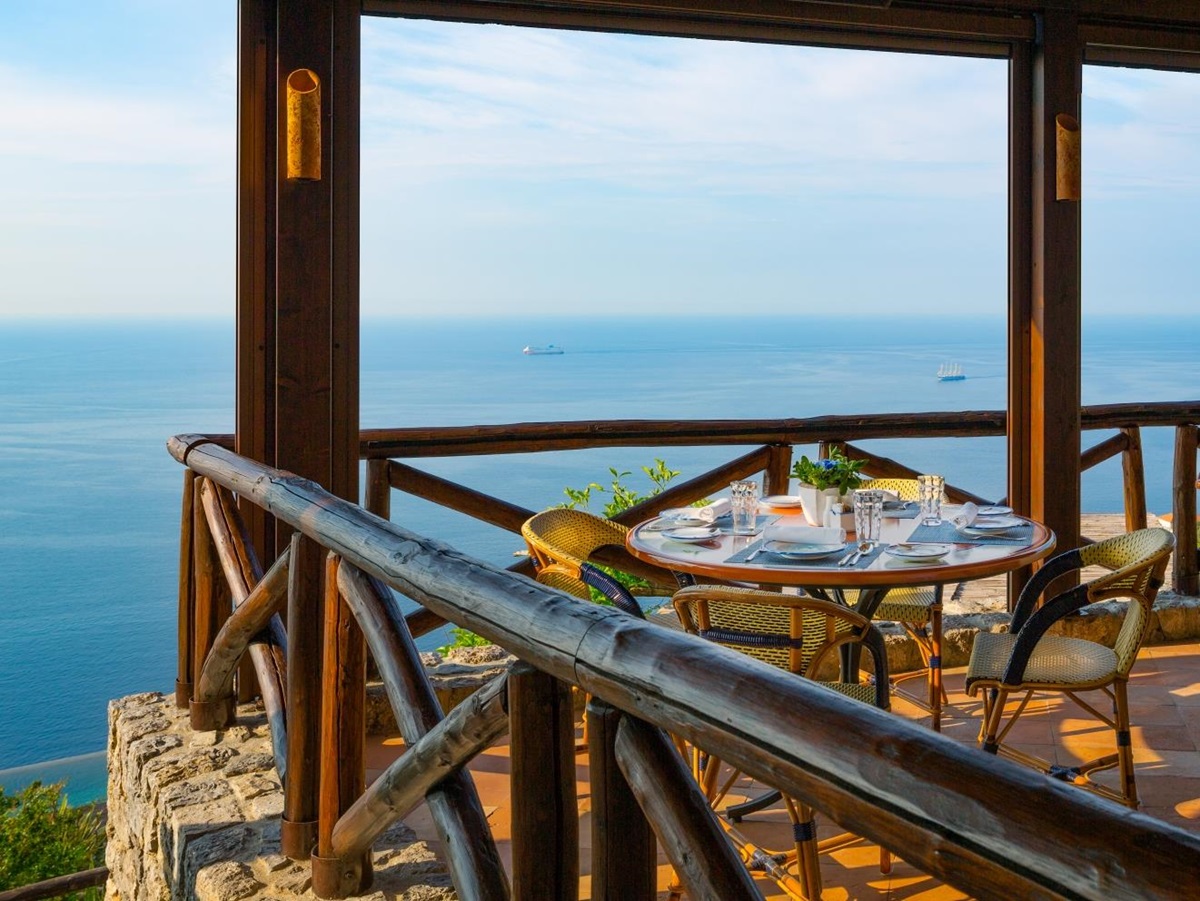 Terrace dining, overlooking the Mediterranean Sea at Monastera Santa Rosa, luxury hotel in Italy