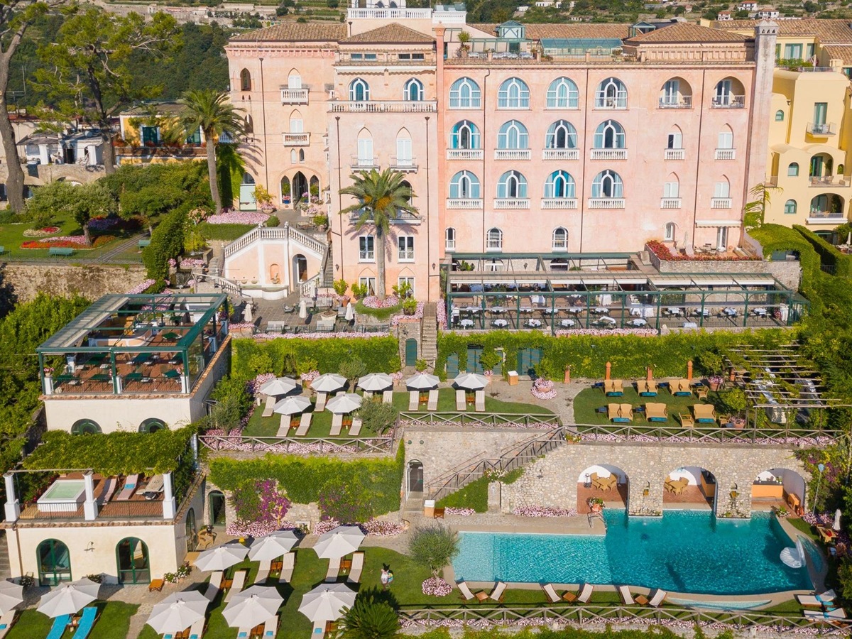 Aerial view of Palazzo Avino, its lush gardens and pool, terrace dining and sun loungers