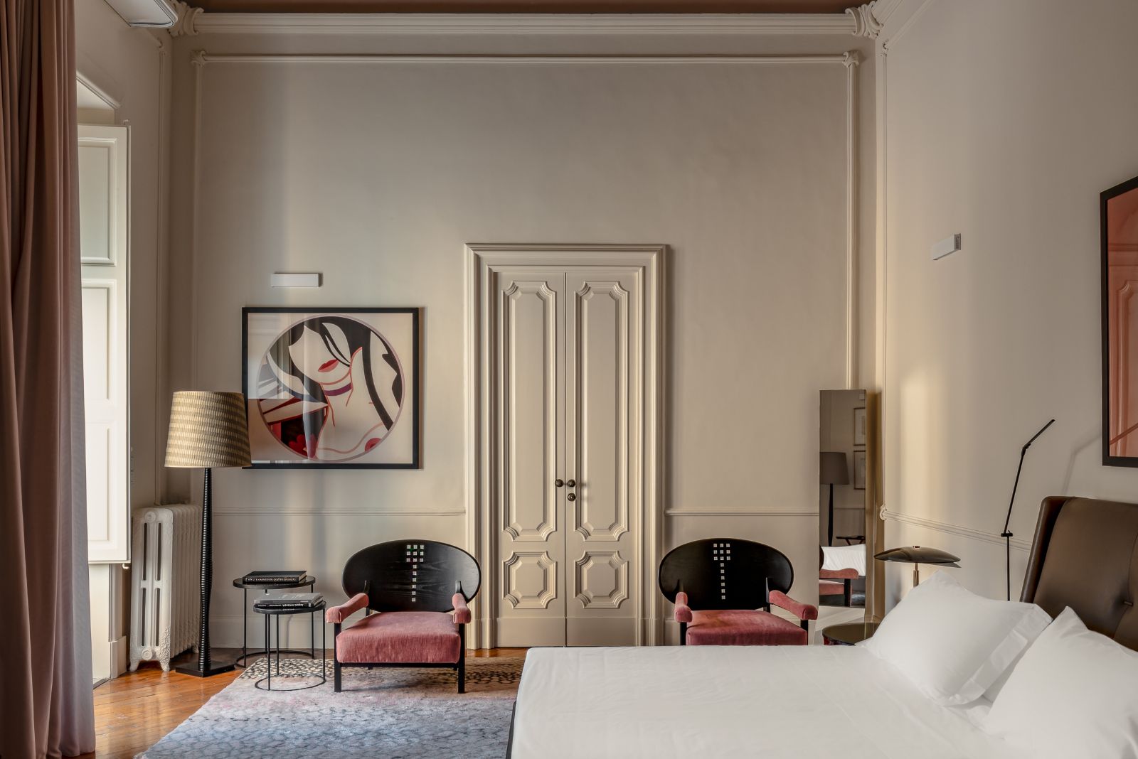 High-ceilinged Bedroom of the Lady Astor Suite at luxury hotel Palazzo Bozzi Corso in Lecce, Italy