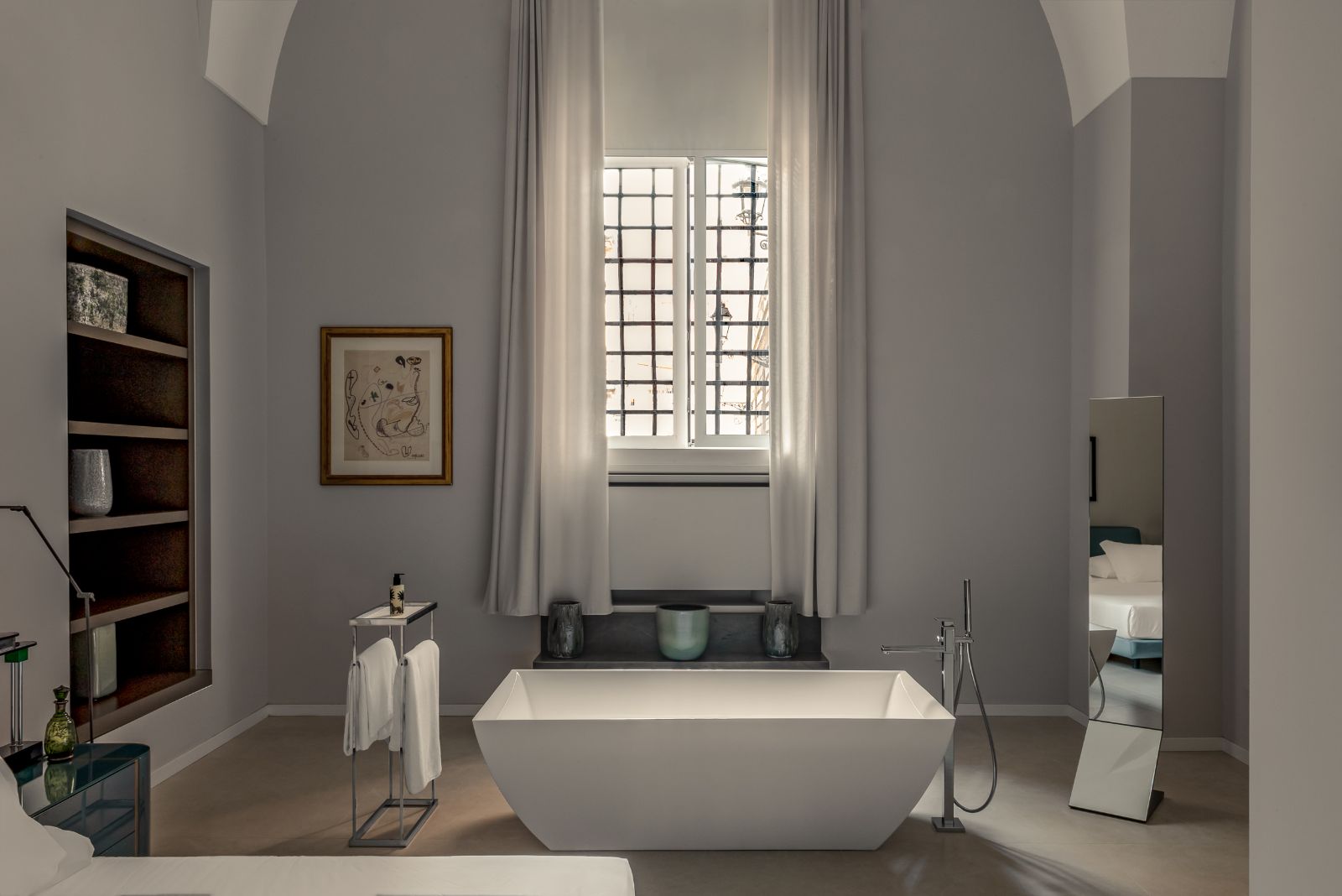 Freestanding bathtub in the bathroom of the Letourneur Suite at luxury hotel Palazzo Bozzi Corso in Lecce, Italy