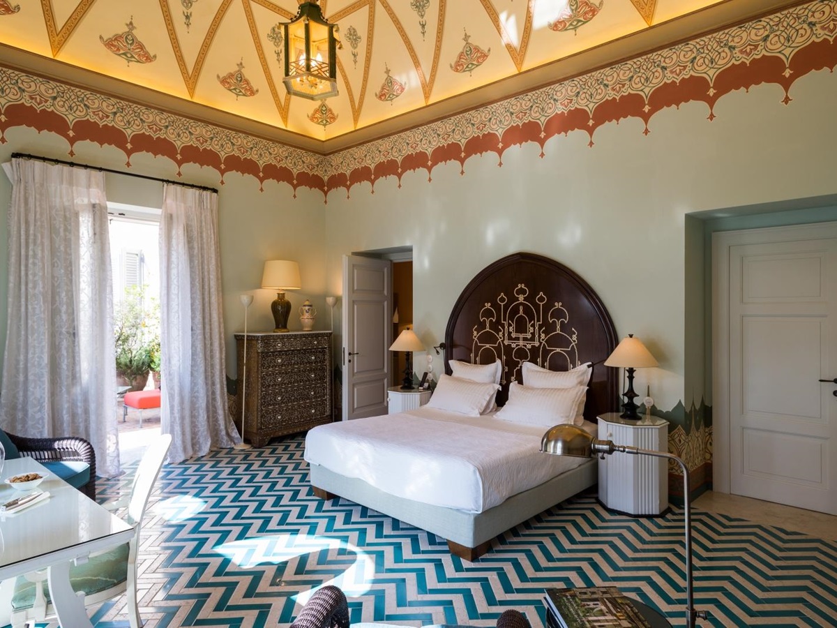 Guest suite with ornate ceiling at Palazzo Margherita