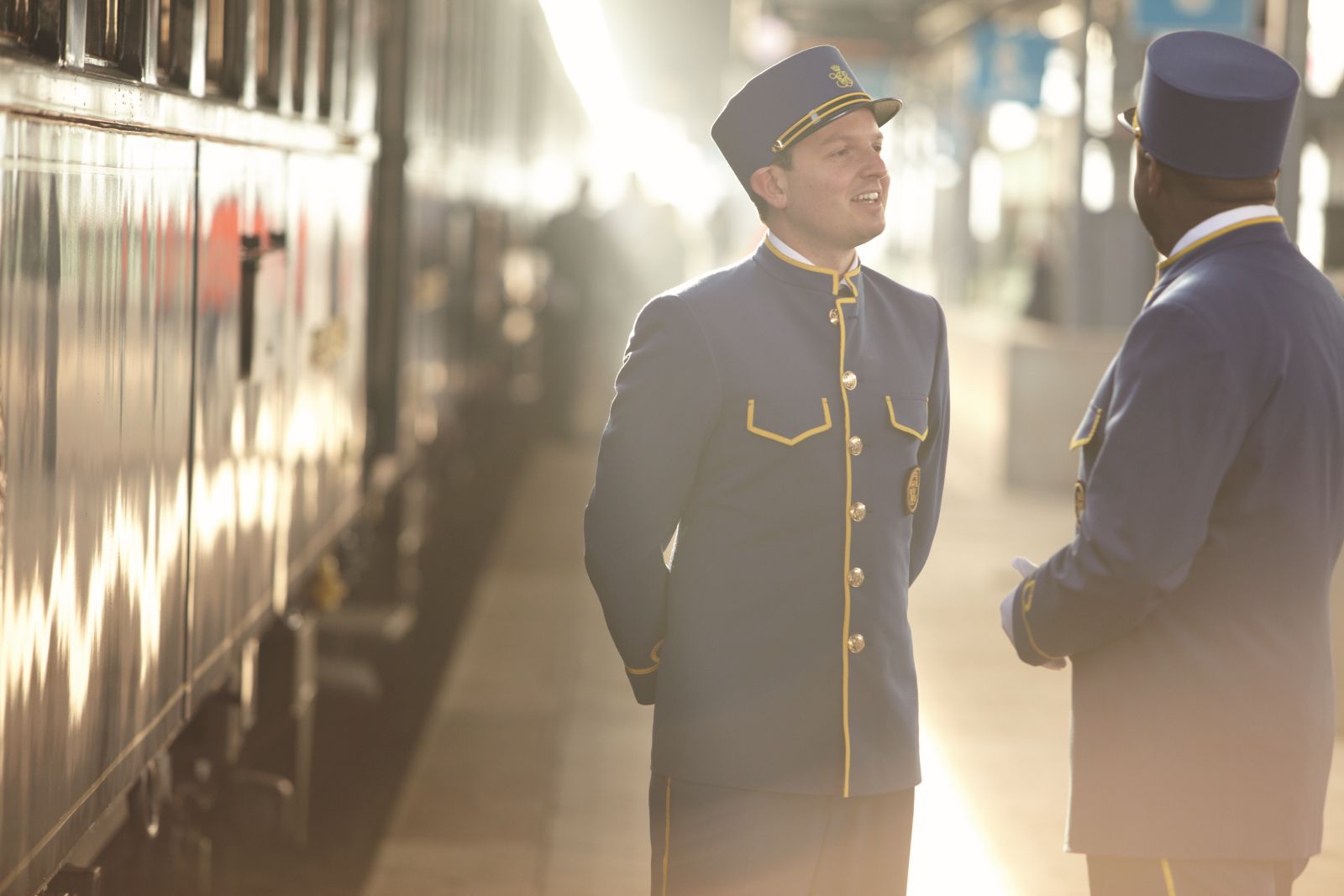 Staff on the platfrom by the Venice Simplon Orient Express train