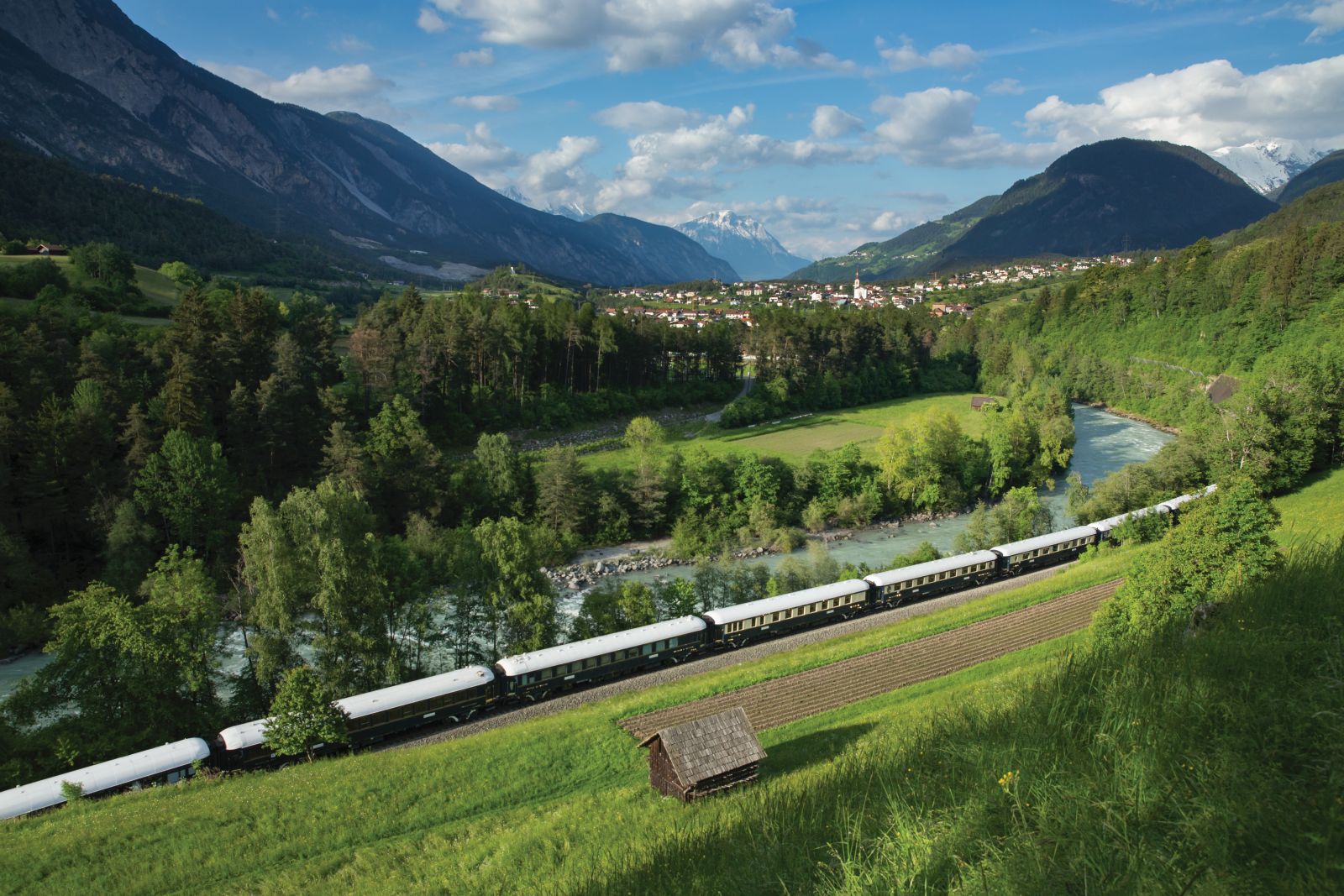The Venice Simplon Orient Express train passing through countryside