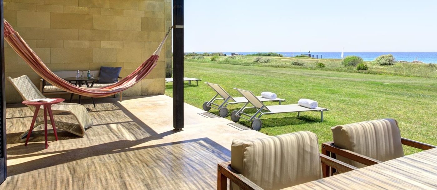 Grand Suite Terrace view with hammock at Verdura Resort in Italy