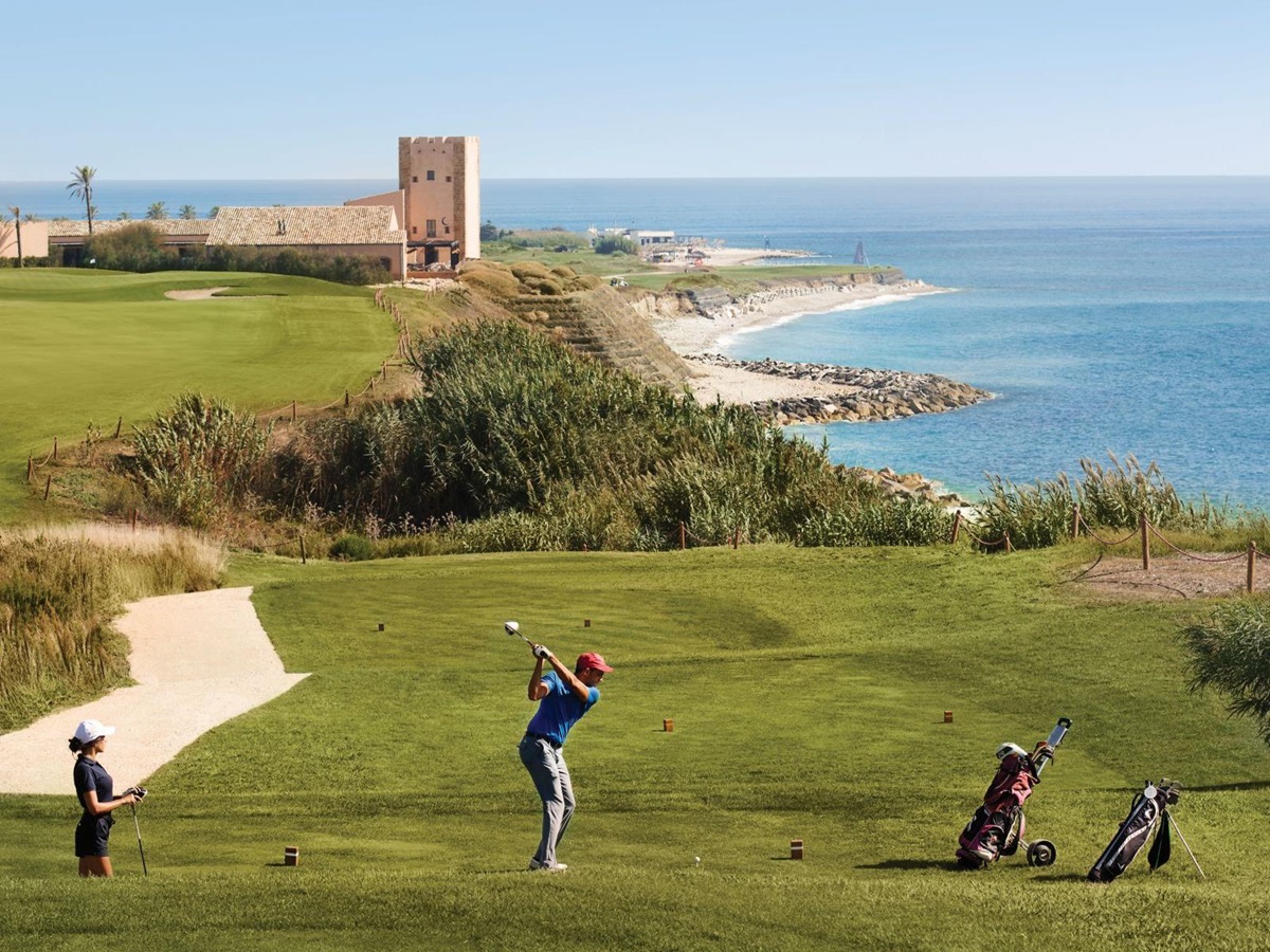 Golfers playing on the links golf course at Rocco Forte Verdura Resort in Sicily