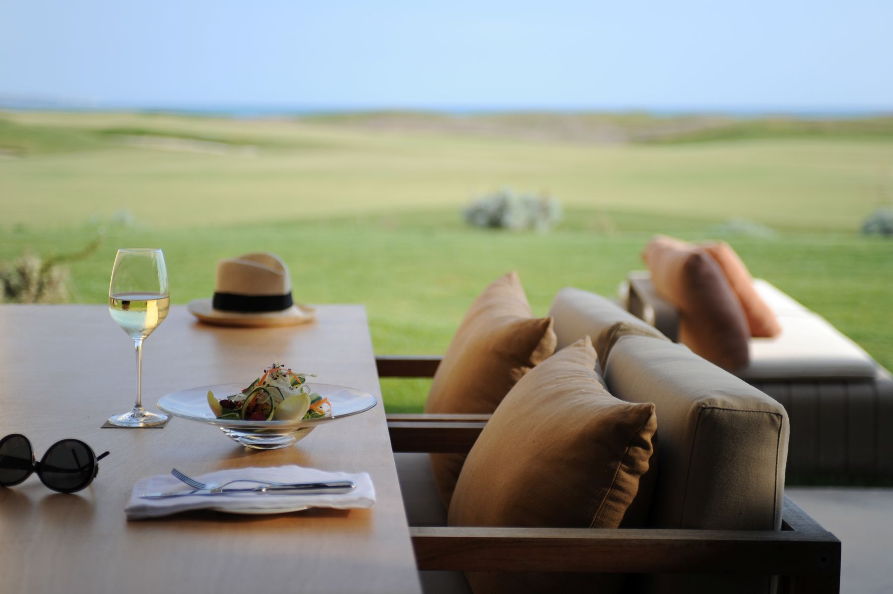 Detail photo of a table with golf course view at Rocco Forte Verdura Resort