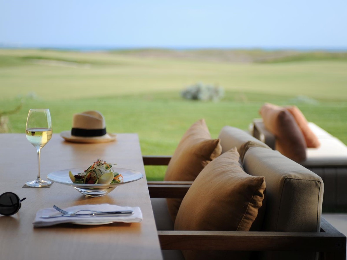 Detail photo of a table with golf course view at Rocco Forte Verdura Resort