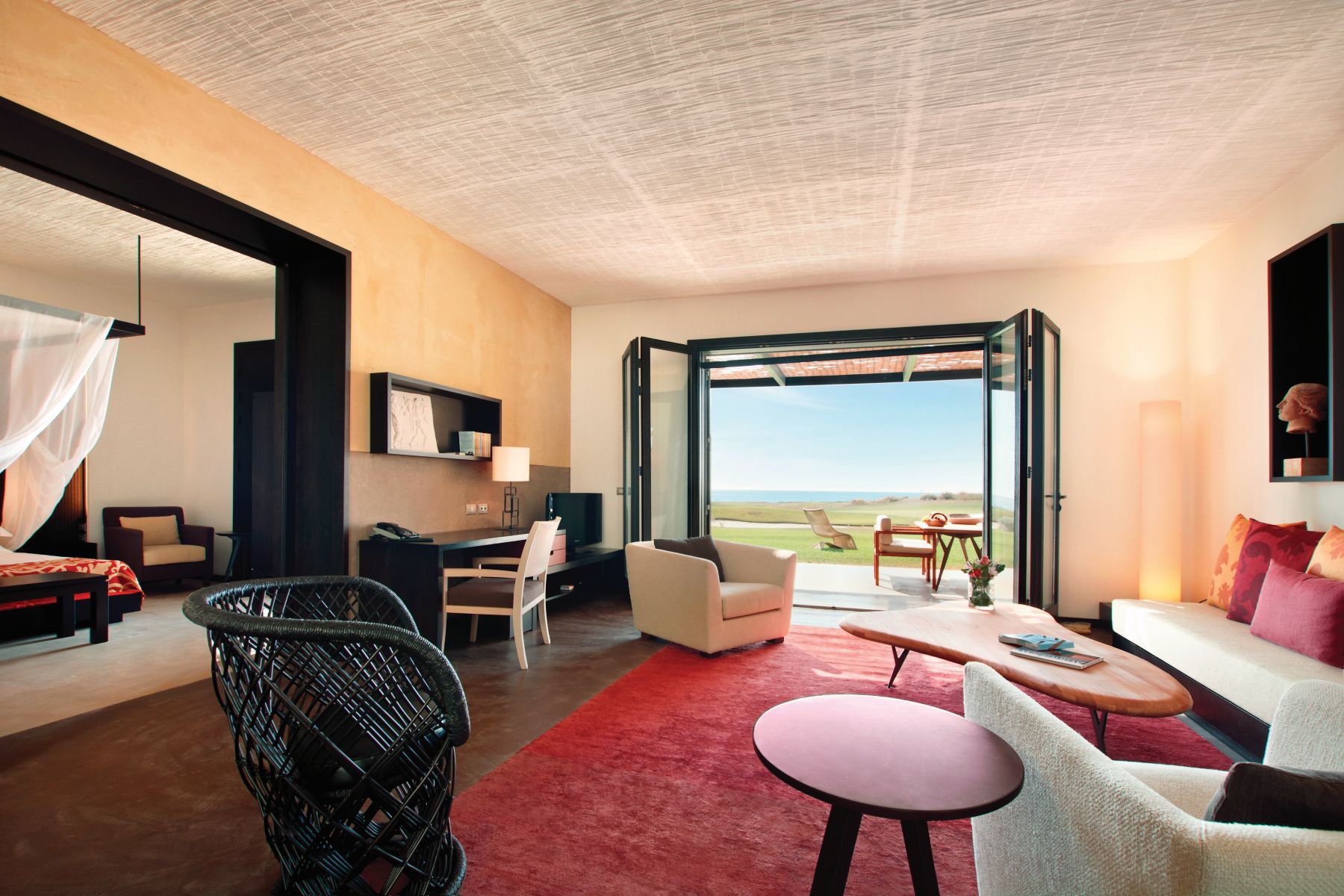 A Grand Suite, wiht French windows onto terrace at Rocco Forte Verdura Resort in Sicily