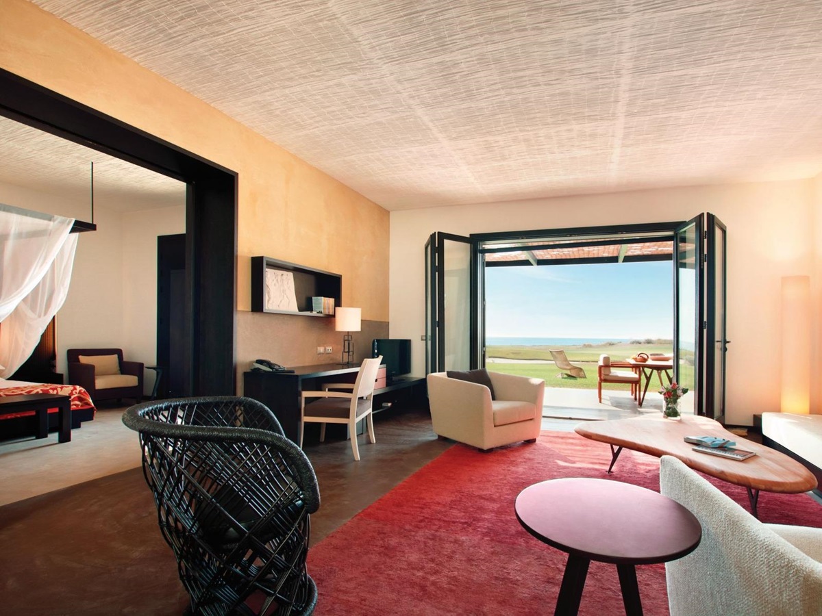 A Grand Suite, wiht French windows onto terrace at Rocco Forte Verdura Resort in Sicily
