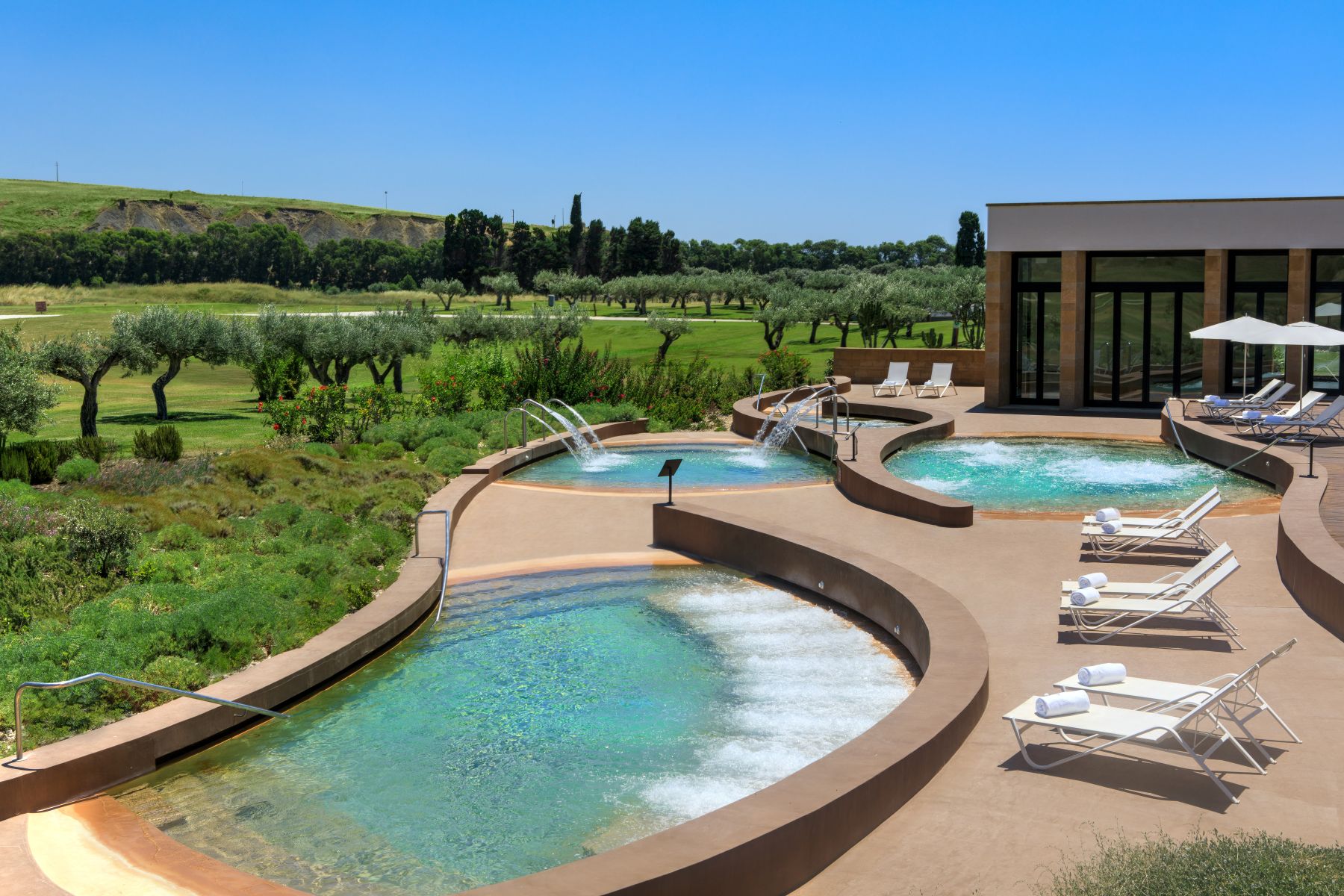 View across the Thelassotherapy poools at Verdura Resort, Sicily