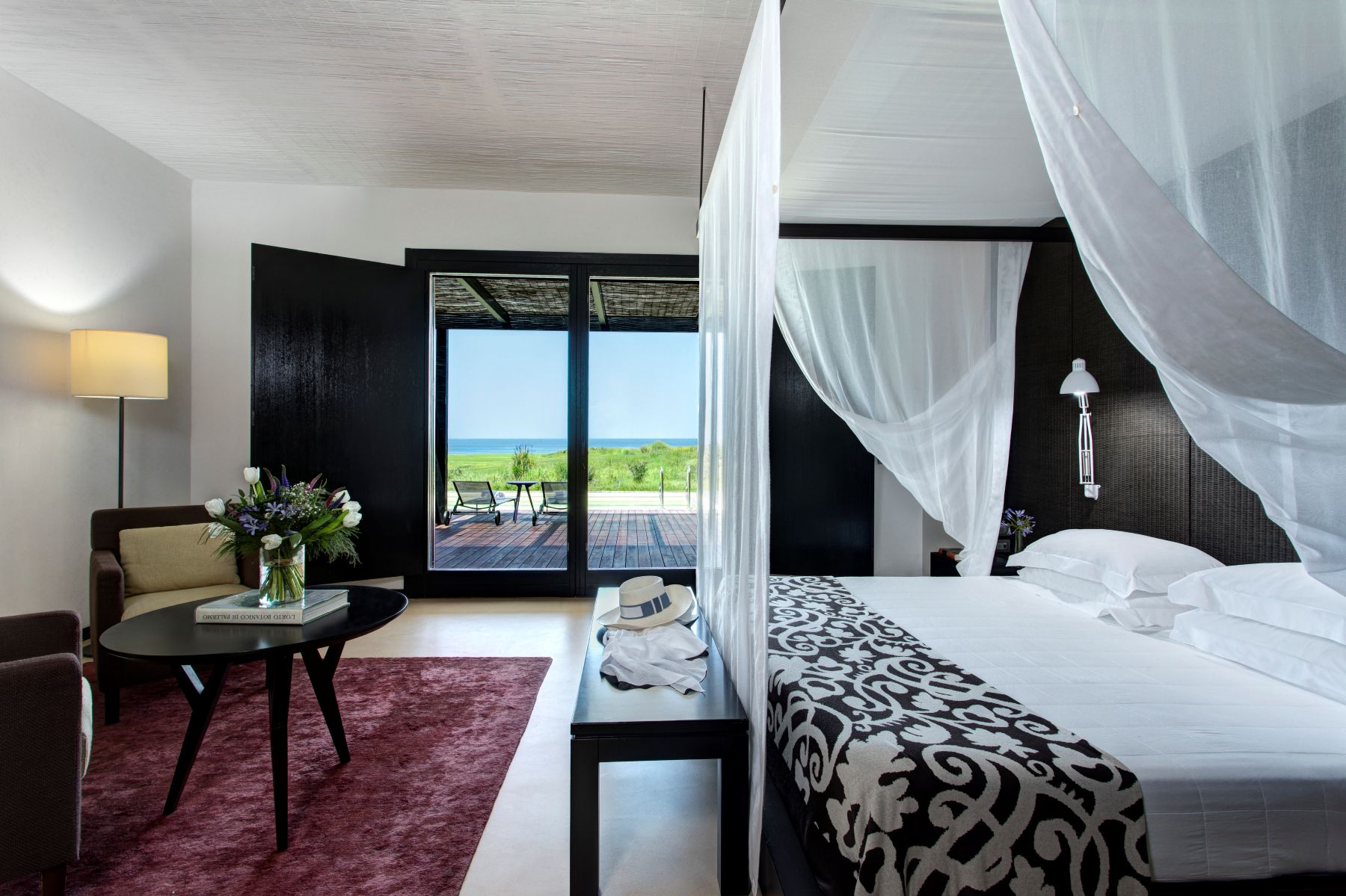 Four poster bed at Villa Peonia at Rocco Forte Verdura Resort in Sicily