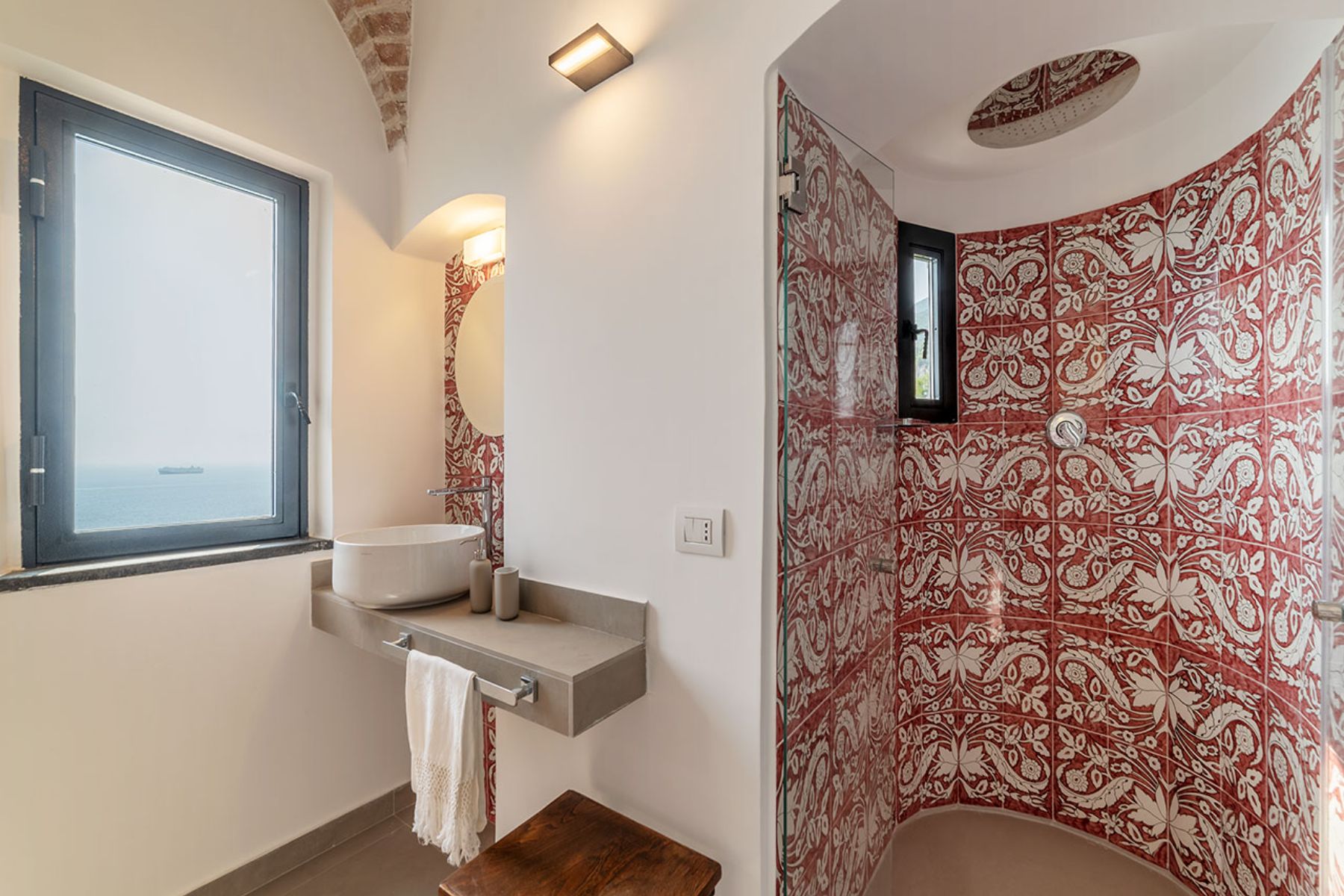 Bathroom with tiled walls and a large shower at Castello Sul Mare in Amalfi