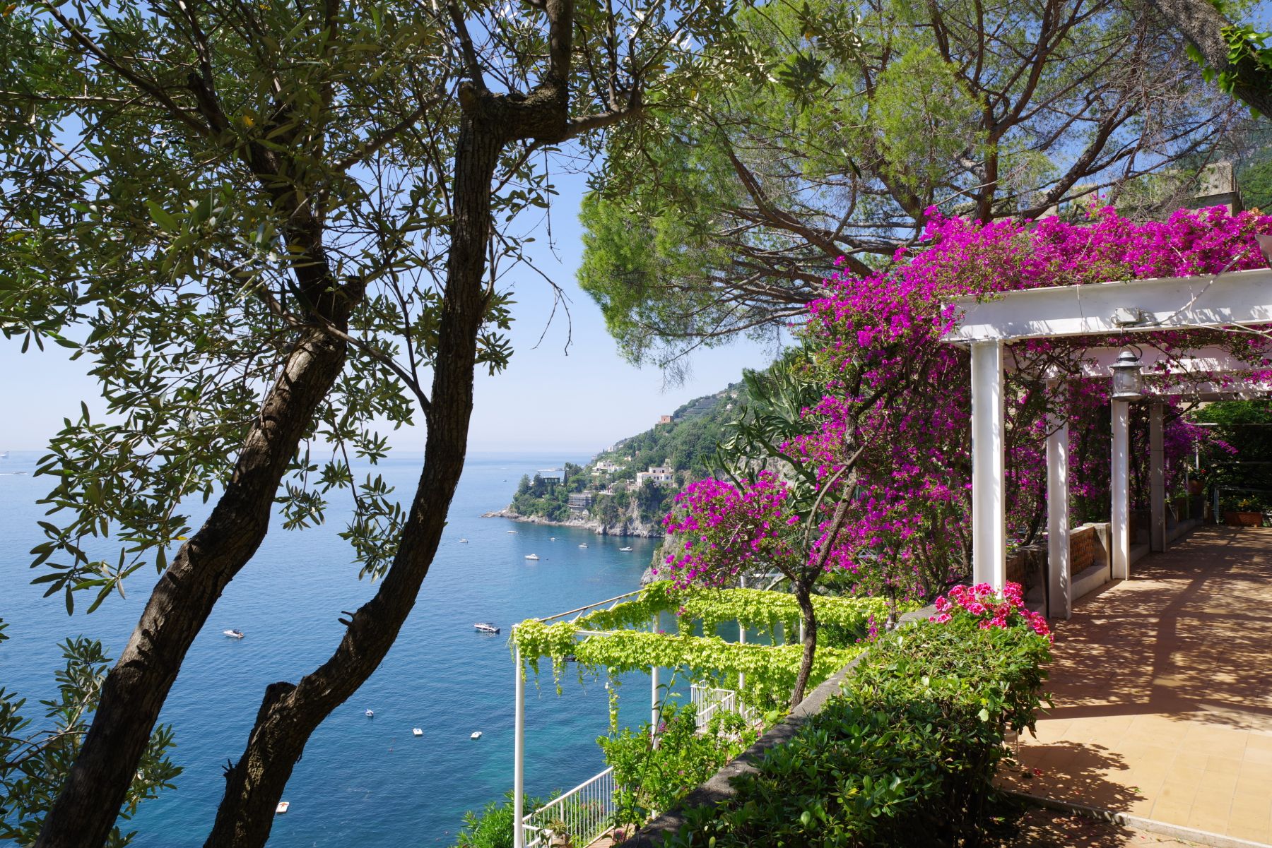 Garden terrace with blossoming flowers and views overlooking the sea in Amalfi at Castello Sul Mare