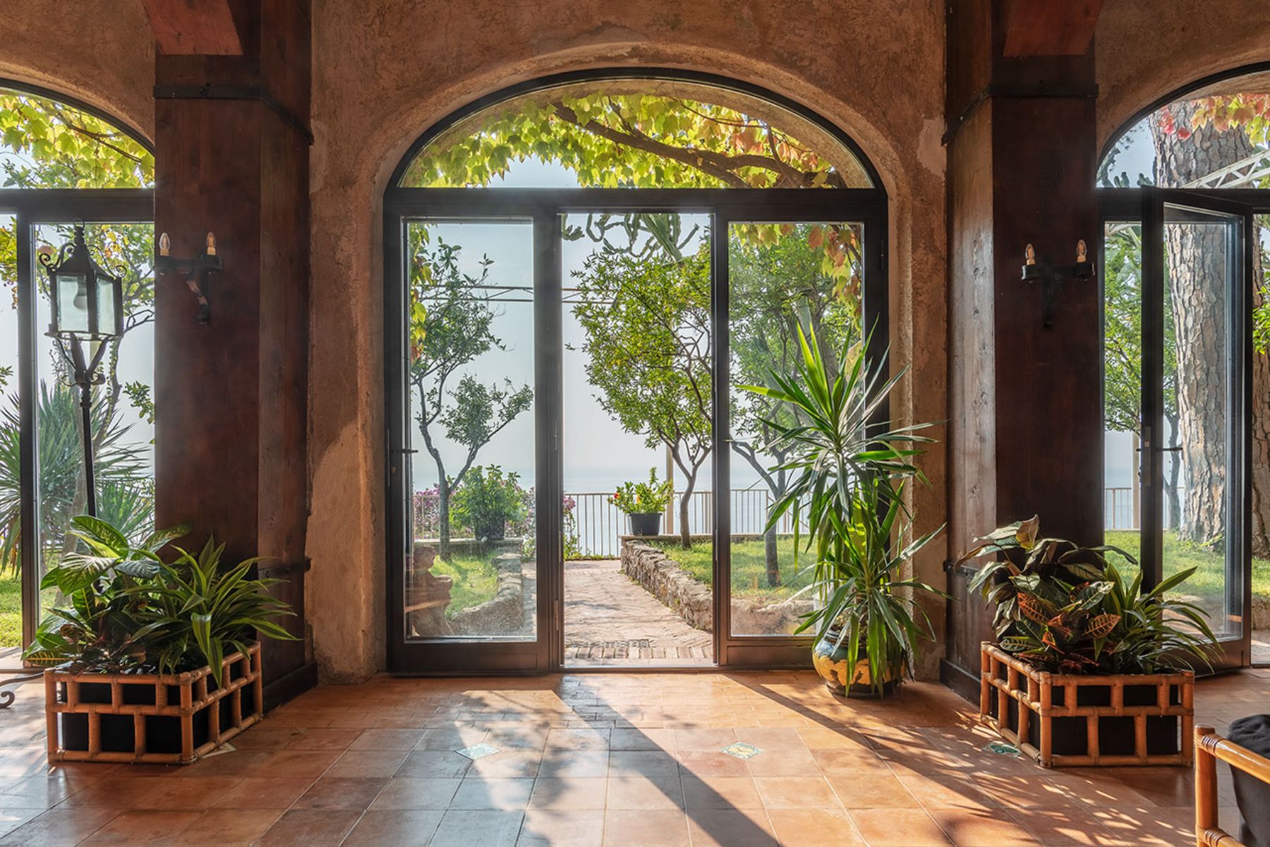 View of the main entrance from inside the villa with view of the outdoor garden at Castello Sul Mare in Amalfi