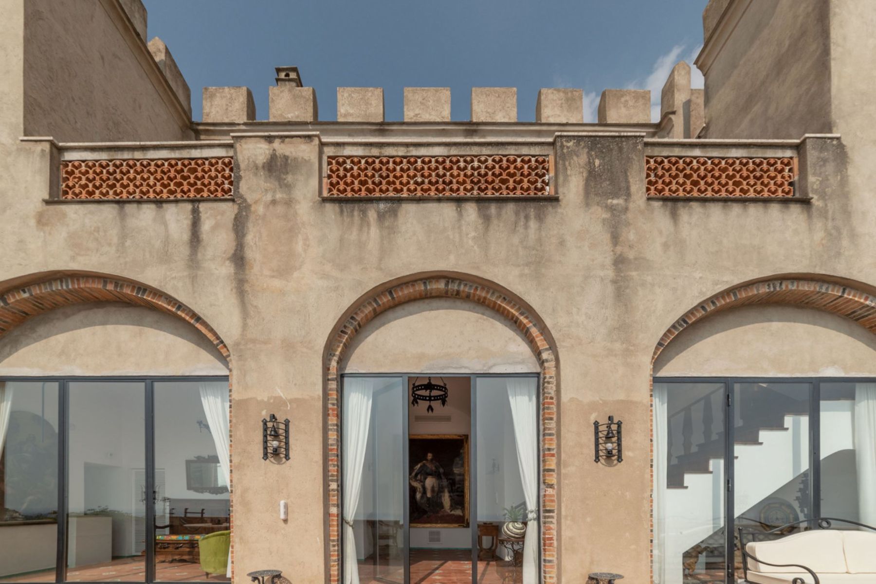 Close up view of the tower building at Castello Sul Mare in Amalfi with arched doorways