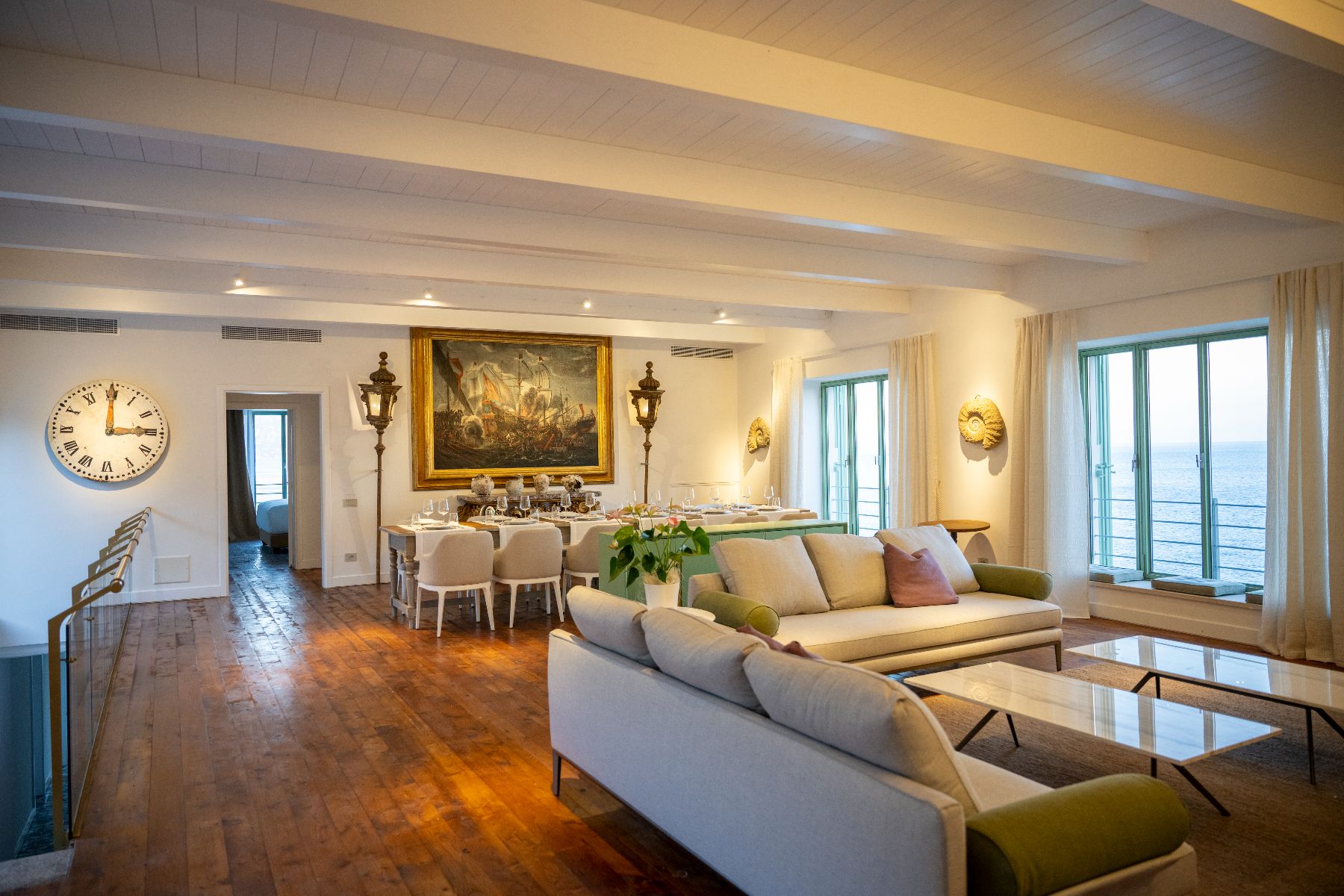 Living room and dining area at Isca Private Island in Amalfi, Italy