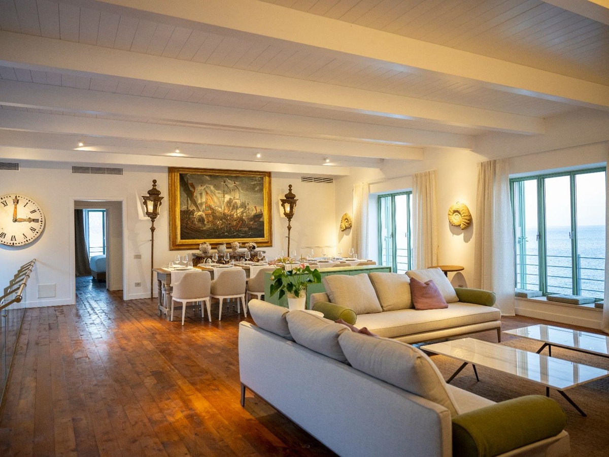 Living room and dining area at Isca Private Island in Amalfi, Italy