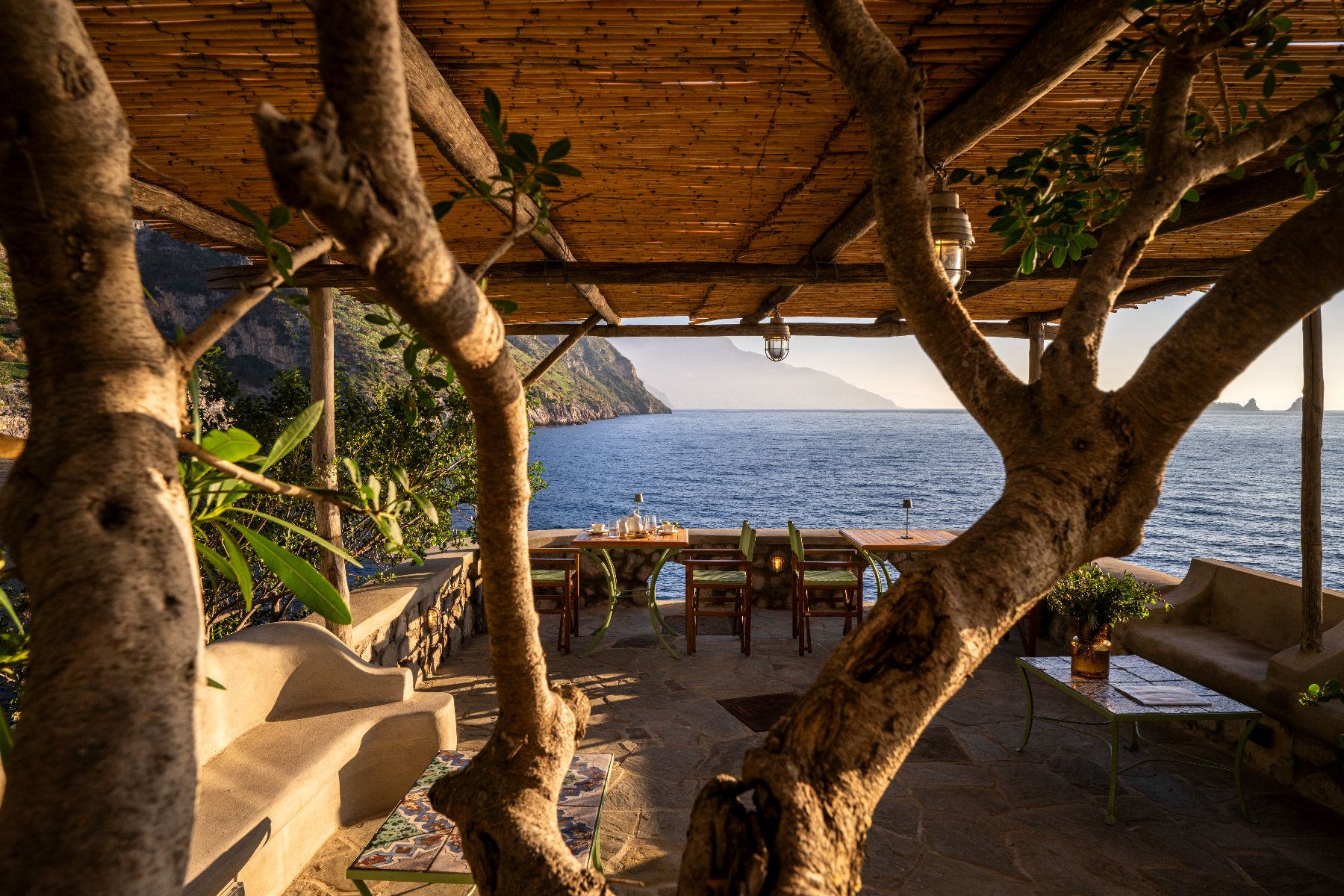 Outdoor dining terrace at Isca Private Island in Amalfi, Italy