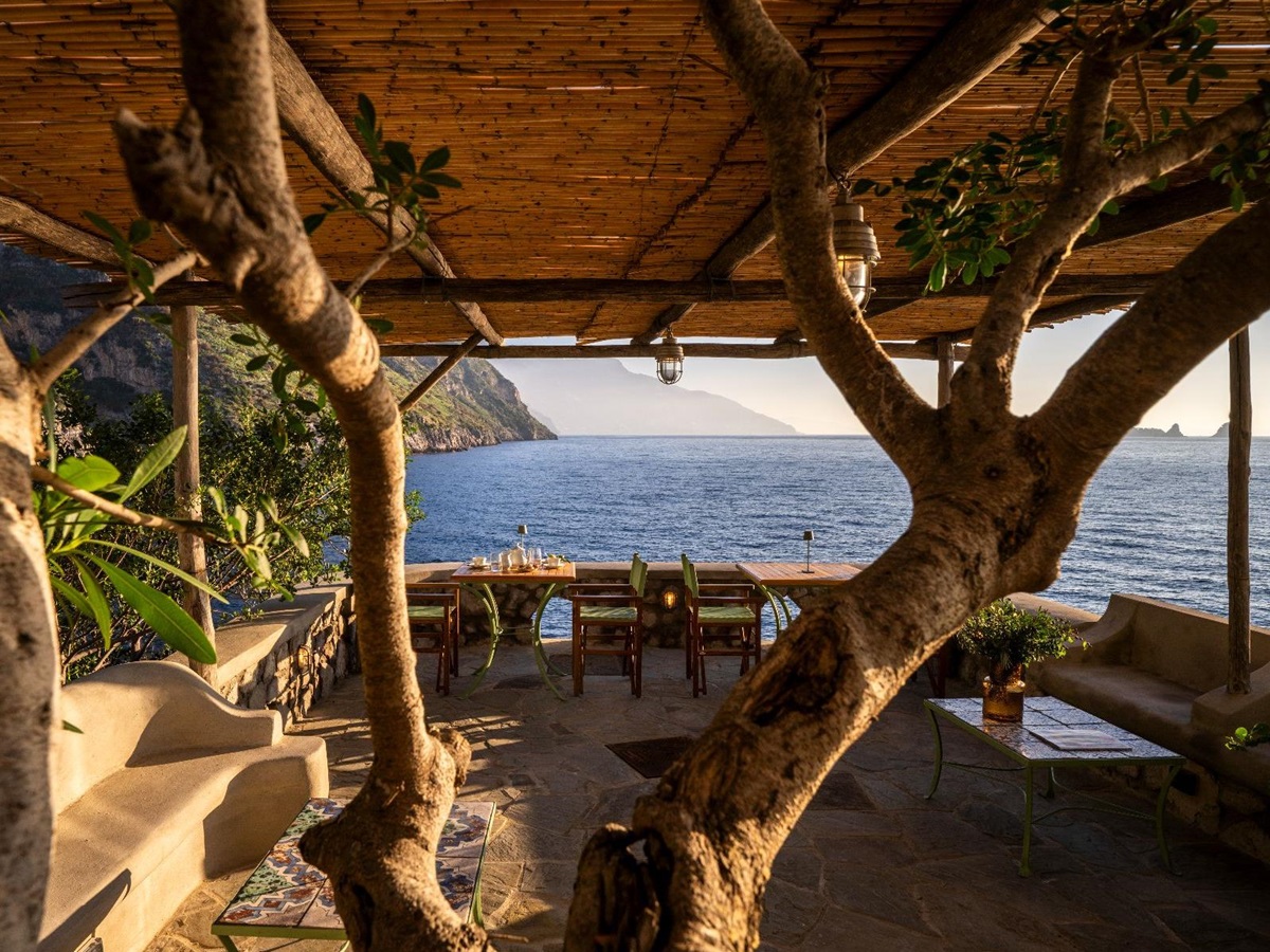 Outdoor dining terrace at Isca Private Island in Amalfi, Italy