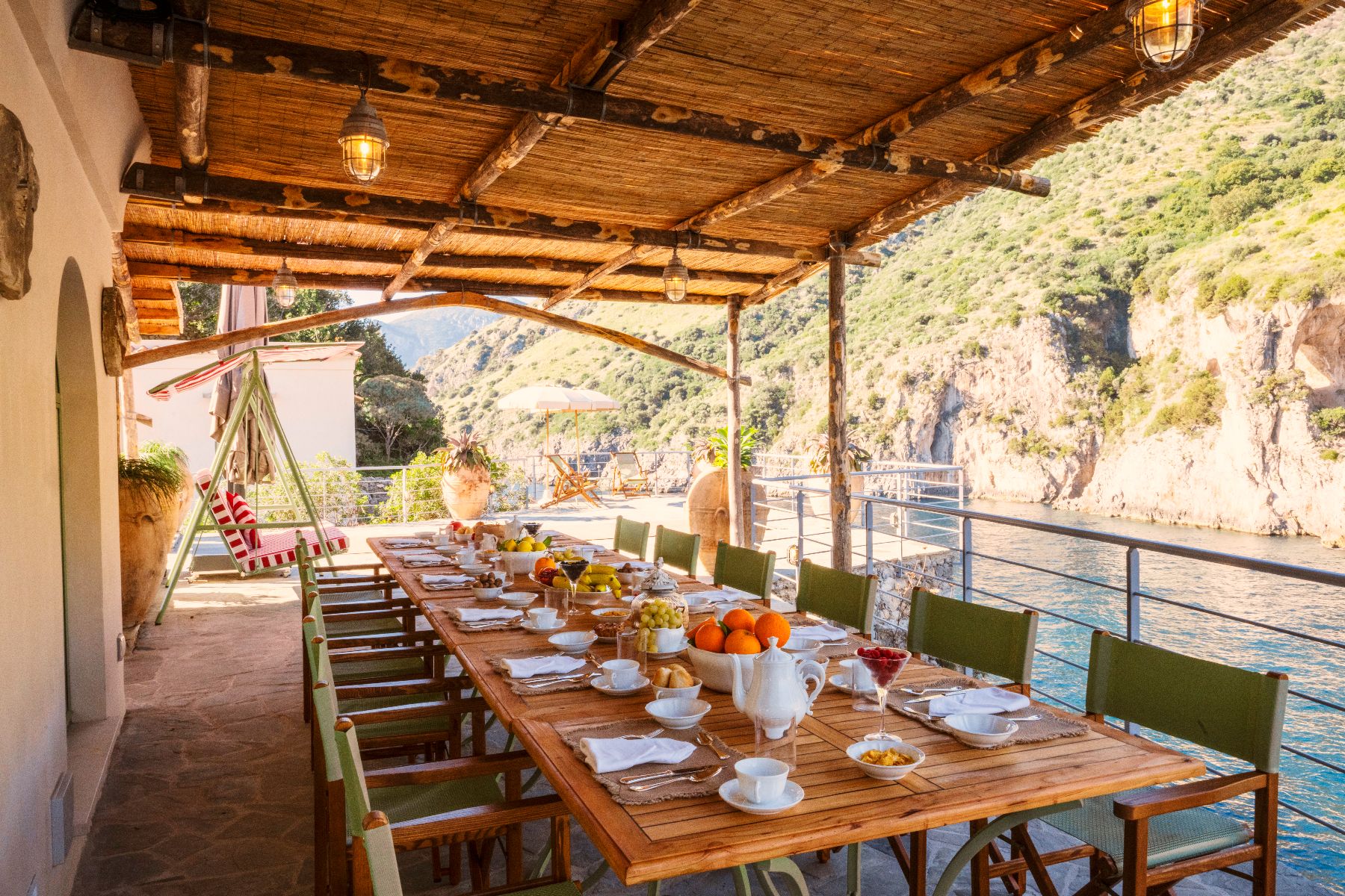 Outdoor dining table at Isca Private Island in Amalfi, Italy