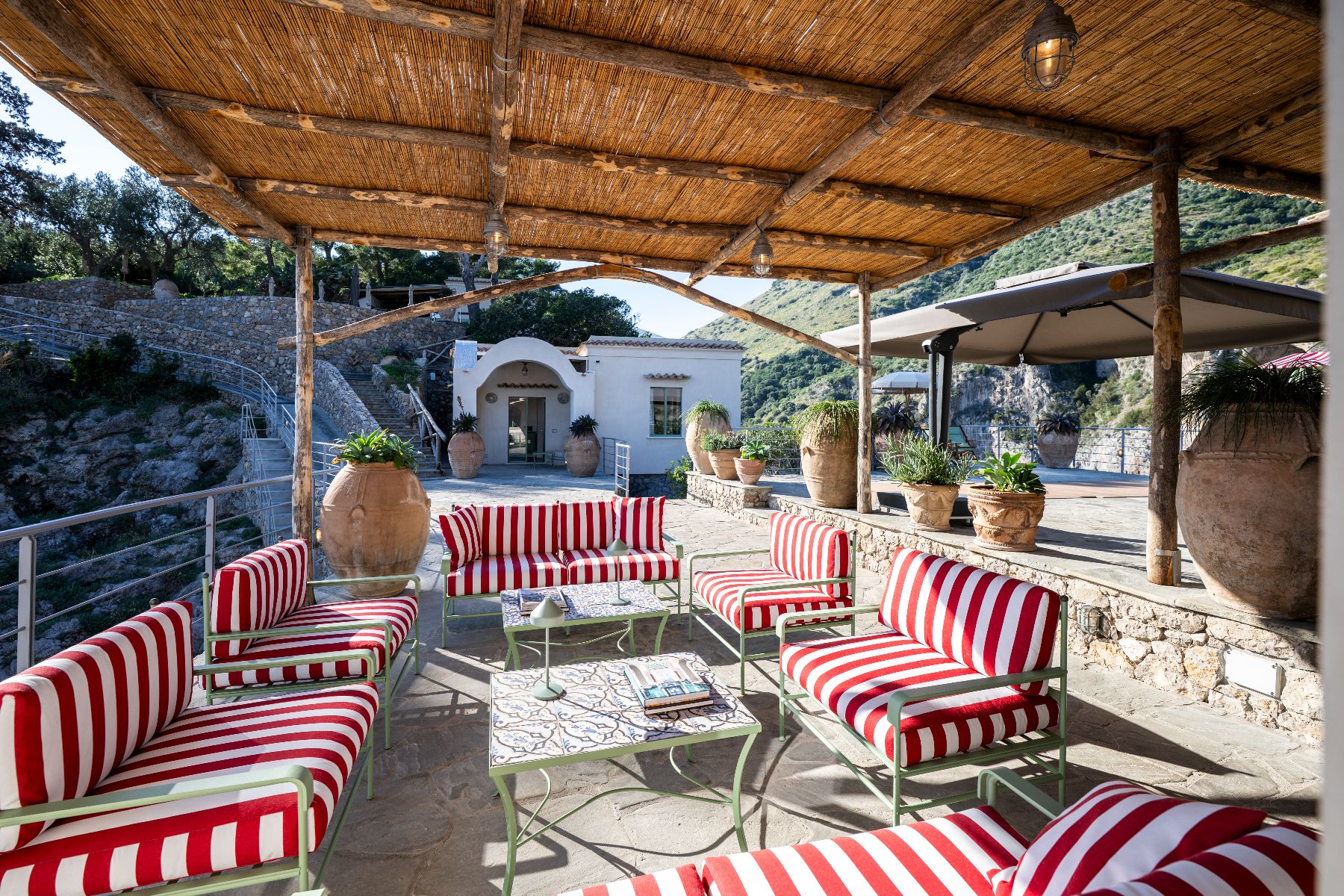 Outdoor seating area at Isca Private Island in Amalfi, Italy