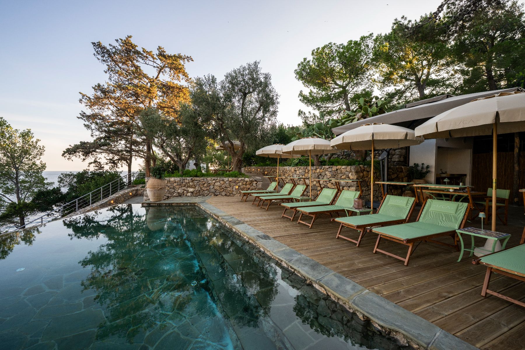 Pool and sunbeds at Isca Private Island in Amalfi, Italy