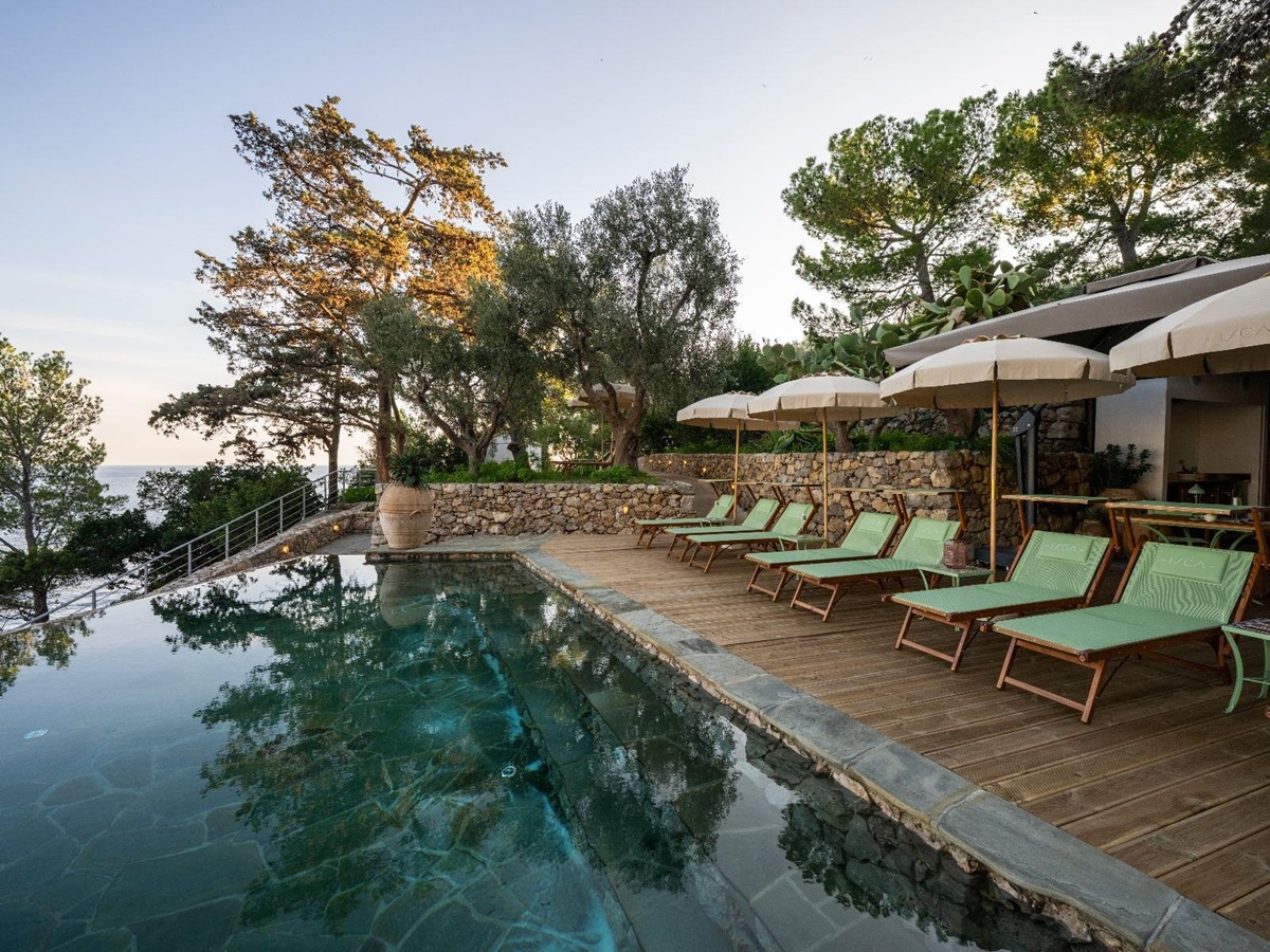 Pool and sunbeds at Isca Private Island in Amalfi, Italy