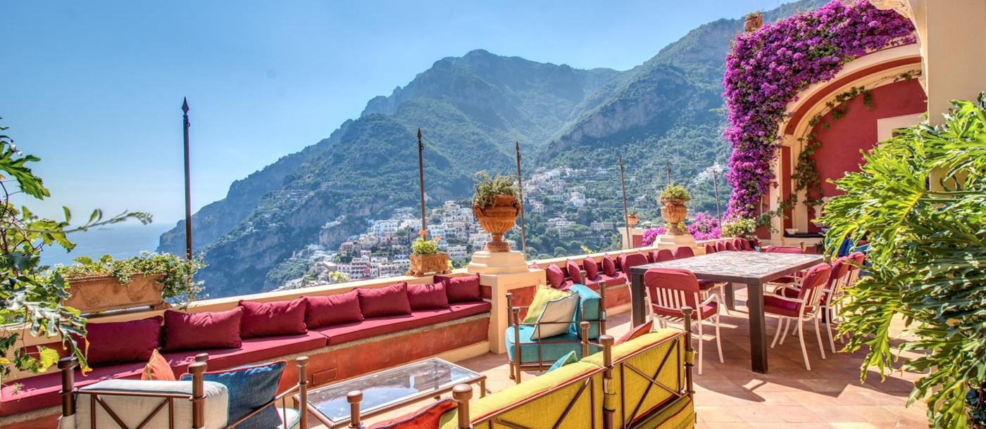 Balcony with outdoor seating and views towards Amalfi