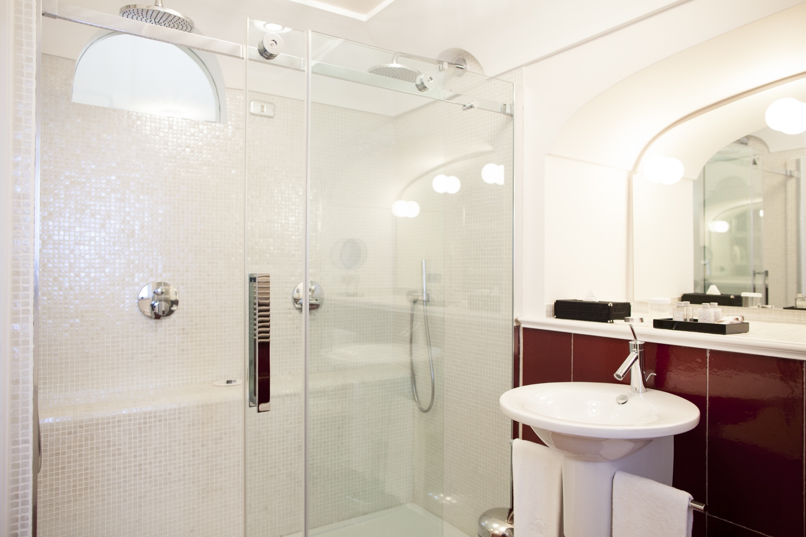 Bathroom with large shower, sink, mirror and window at Villa di Praiano on the Amalfi Coast in Italy