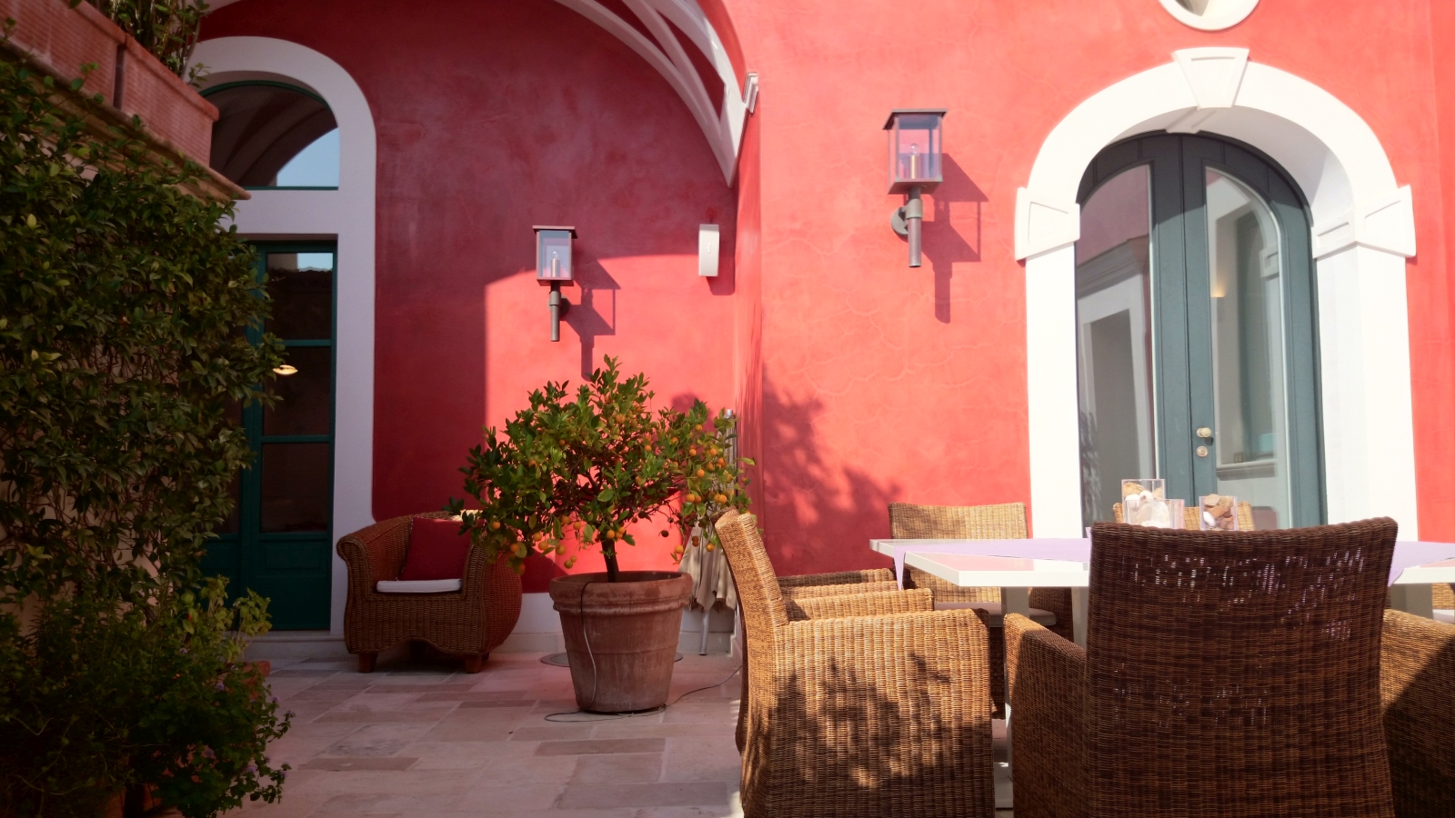 Terrace with table, comfy chairs and citrus tree at Villa di Praiano on the Amalfi Coast in Italy