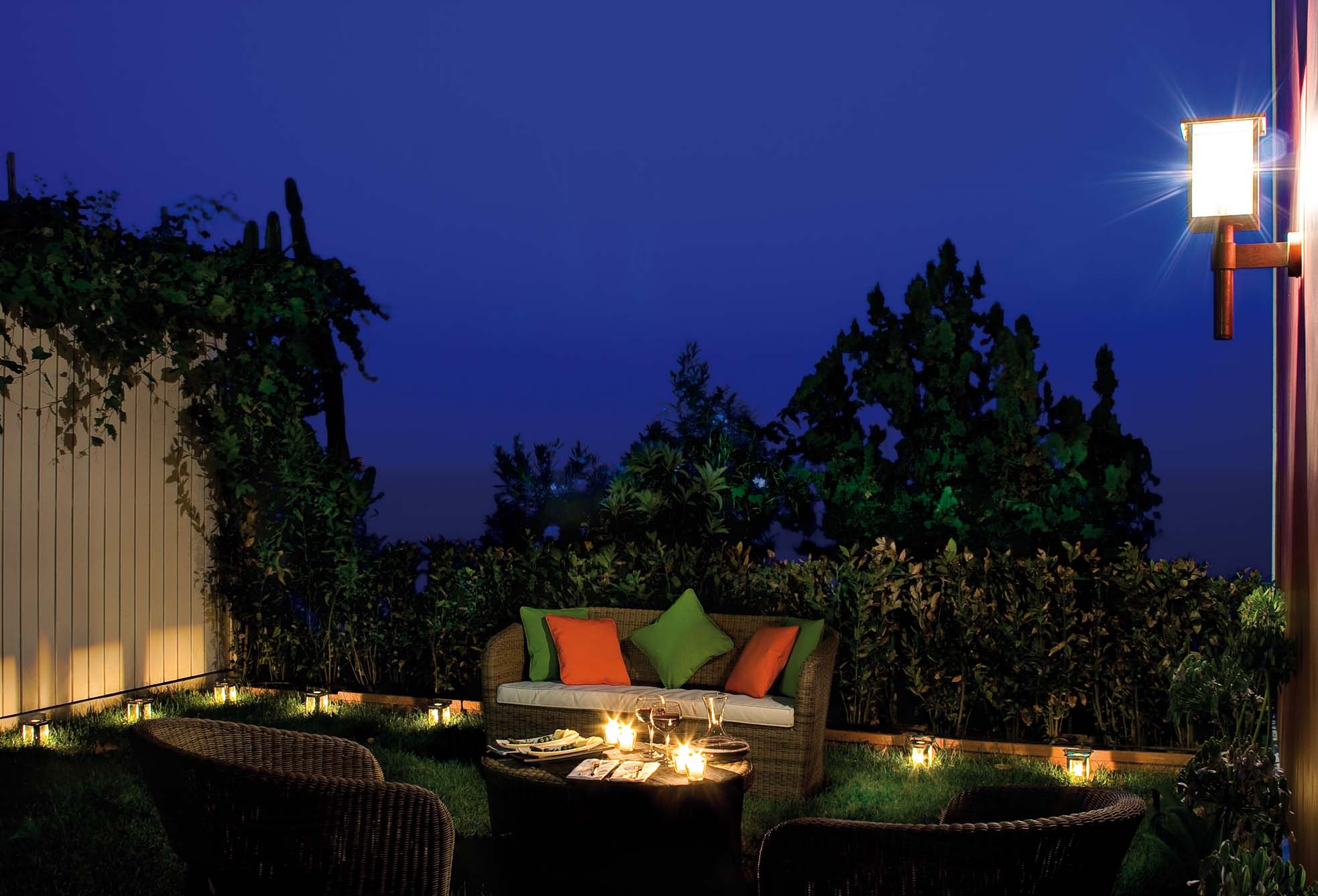 Villa di Praiano's outdoor seating area at night.