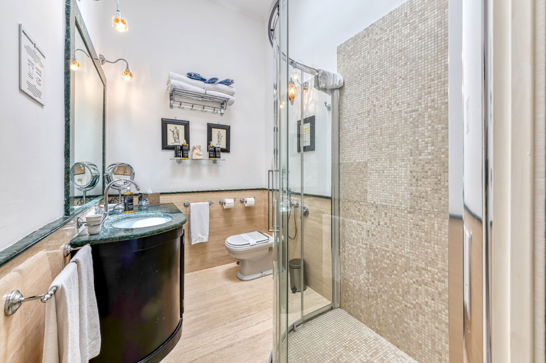 Bathroom with tiled shower and basin area at Villa Li Galli in Amalfi