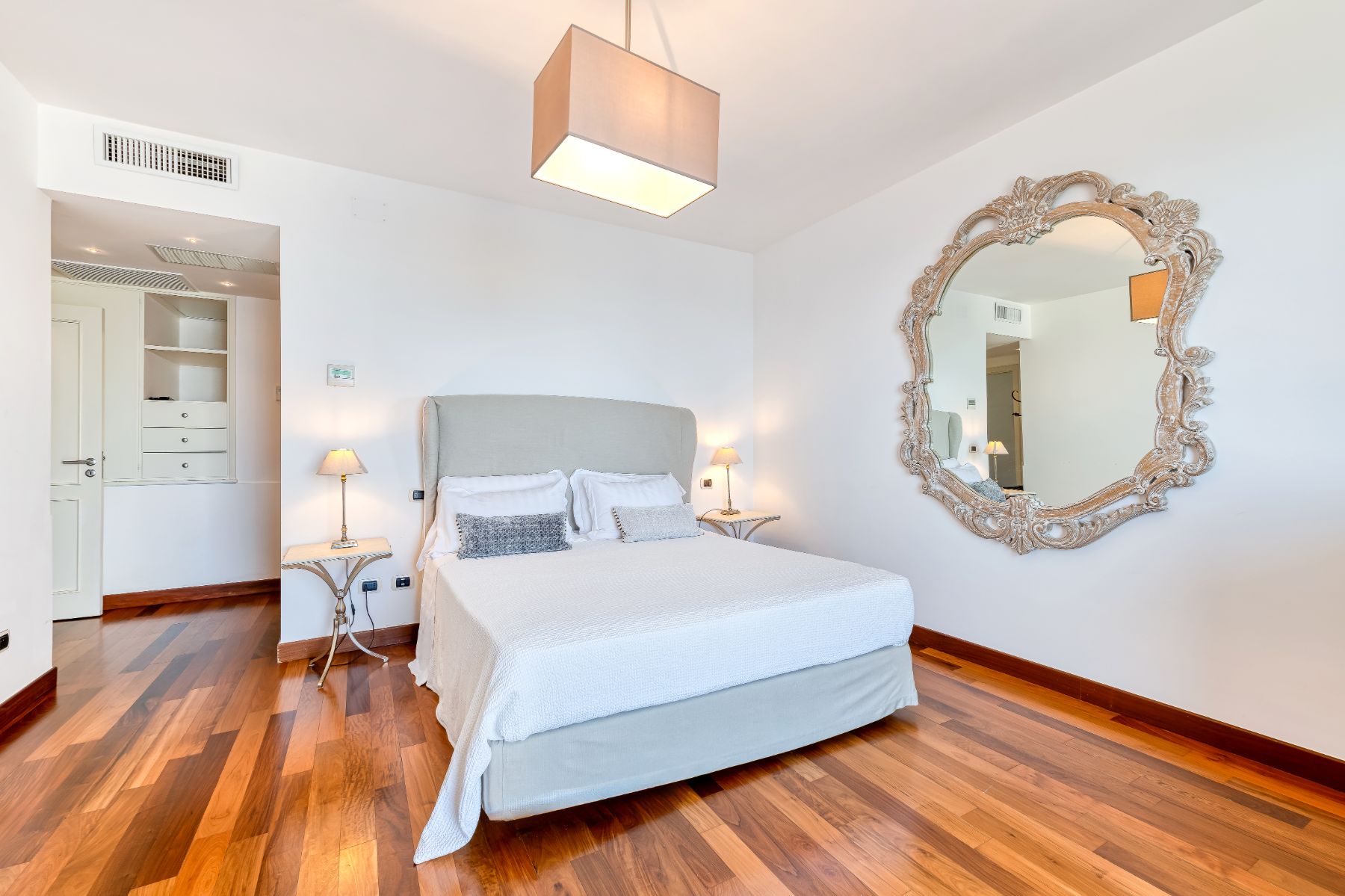 Bedroom double bed and large mirror on the wall in Villa Li Galli in Amalfi