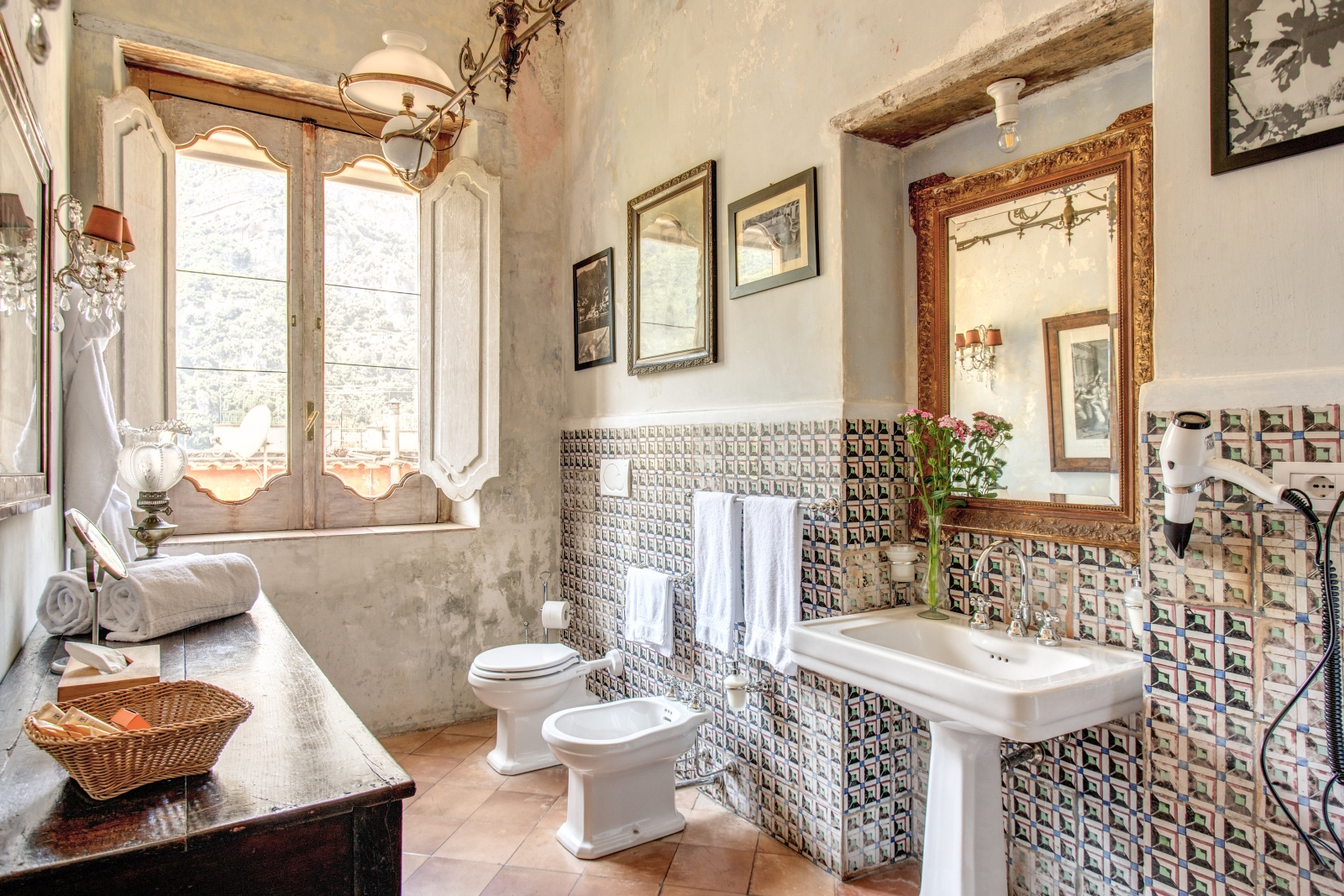 Old-fashioned styled bathroom with sink and mirror and large windows