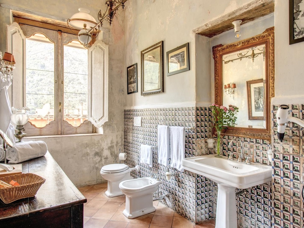 Old-fashioned styled bathroom with sink and mirror and large windows