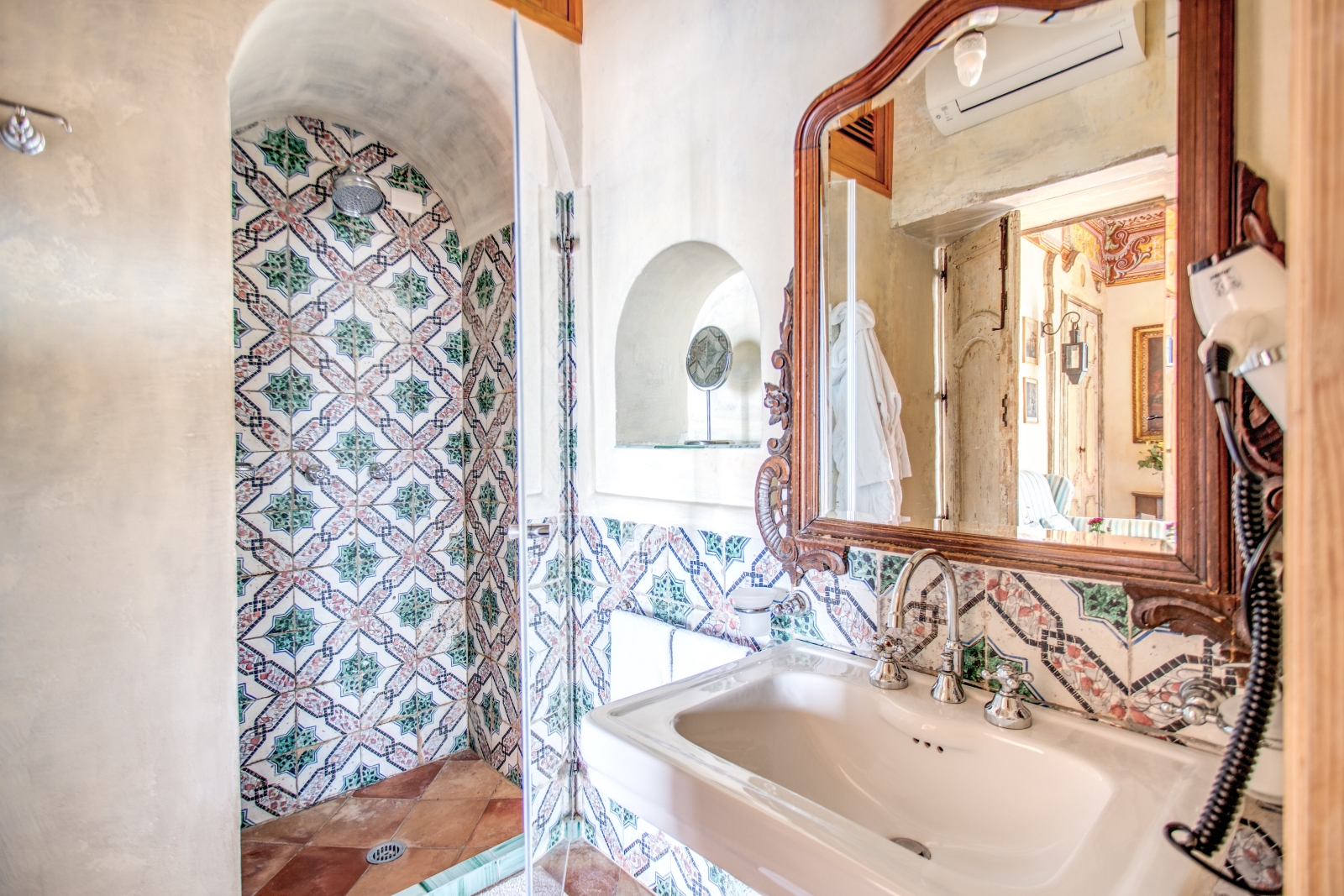 Tiled shower room with large mirror