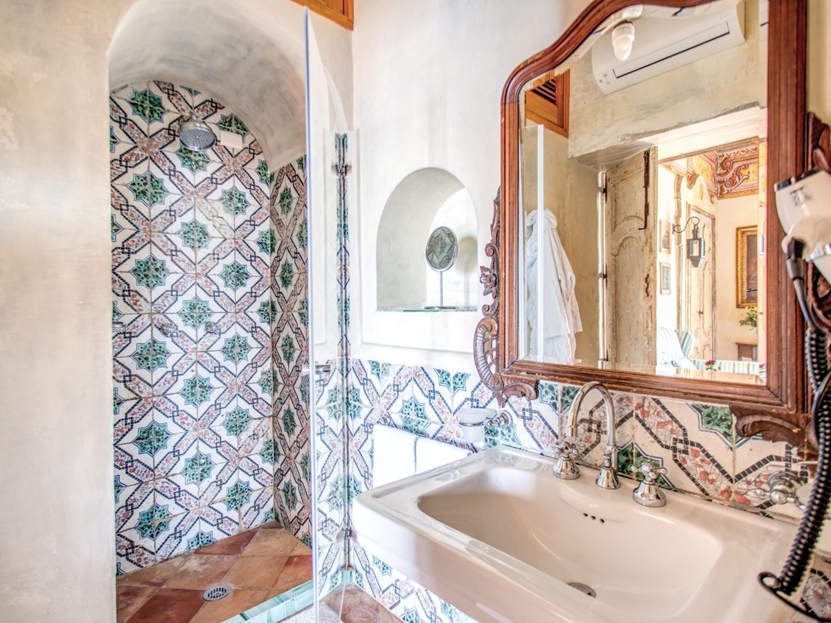 Tiled shower room with large mirror