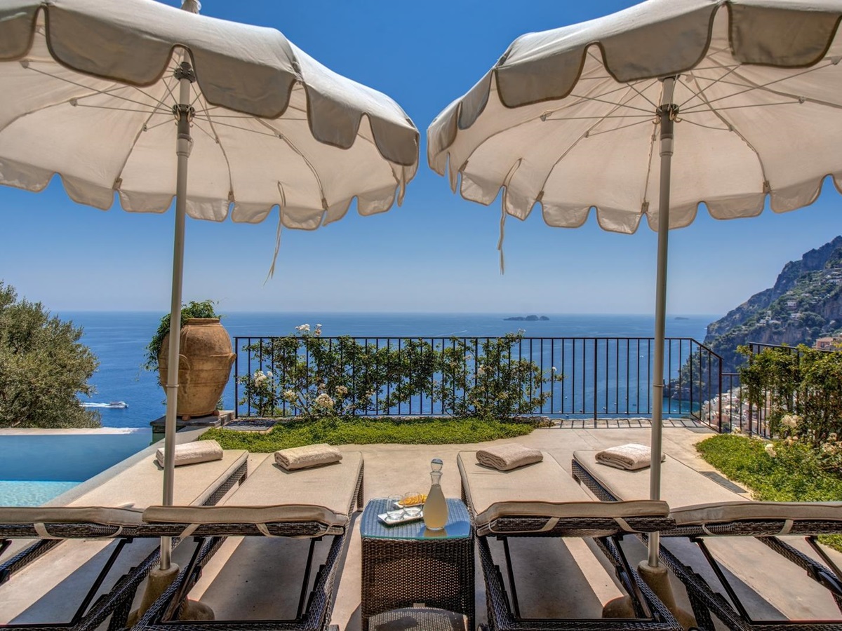 Two sun loungers on the terrace looking out towards the sea
