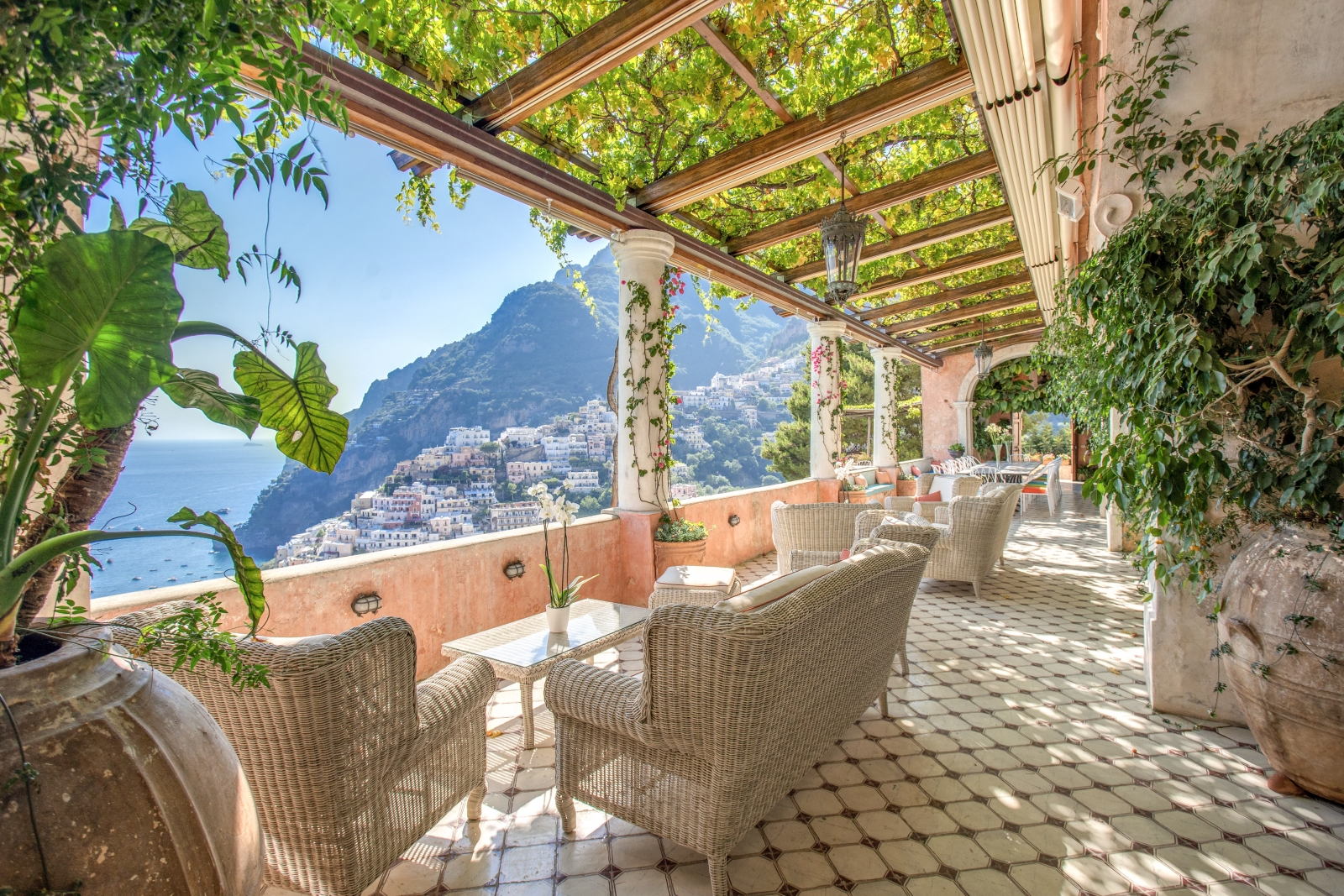 Shaded terrace with comfortable seating and sea views