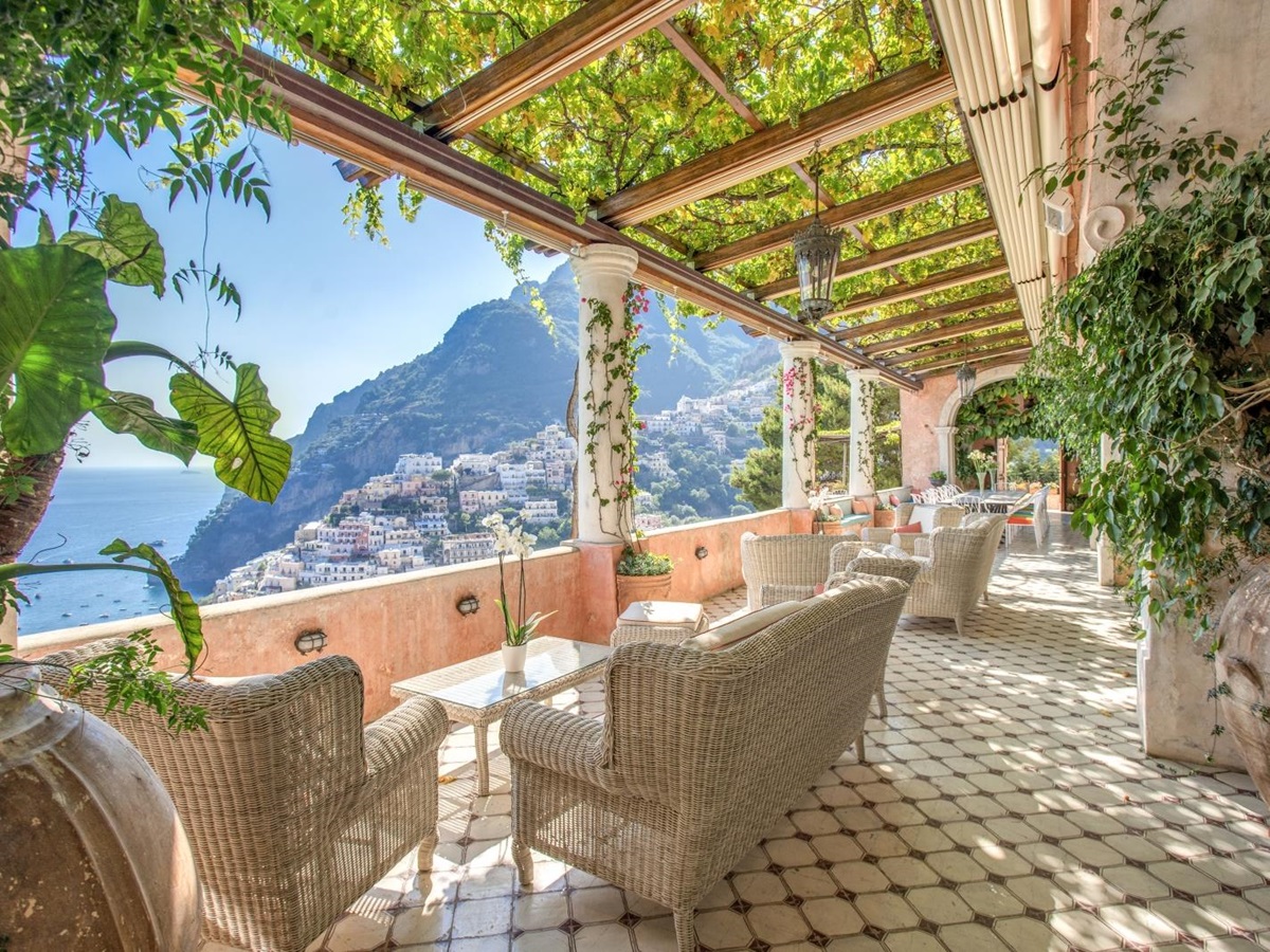 Shaded terrace with comfortable seating and sea views
