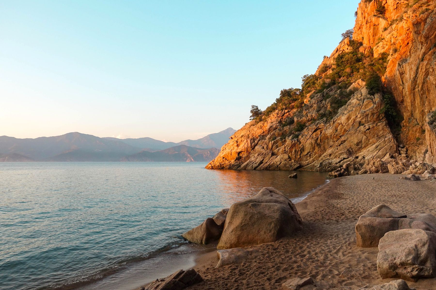 A deserted cove along the Corsican coastline during sunset