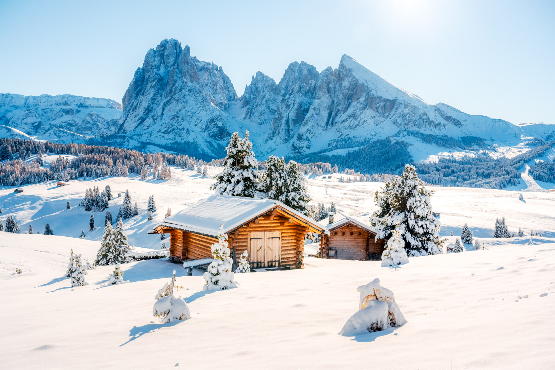 Exterior view of a cabin in the Dolomites during winter