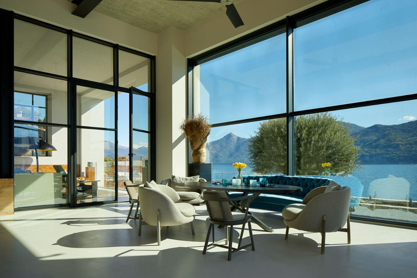 A shot of the interior of the Breakwater, including a view of Lake Como through the large windows.