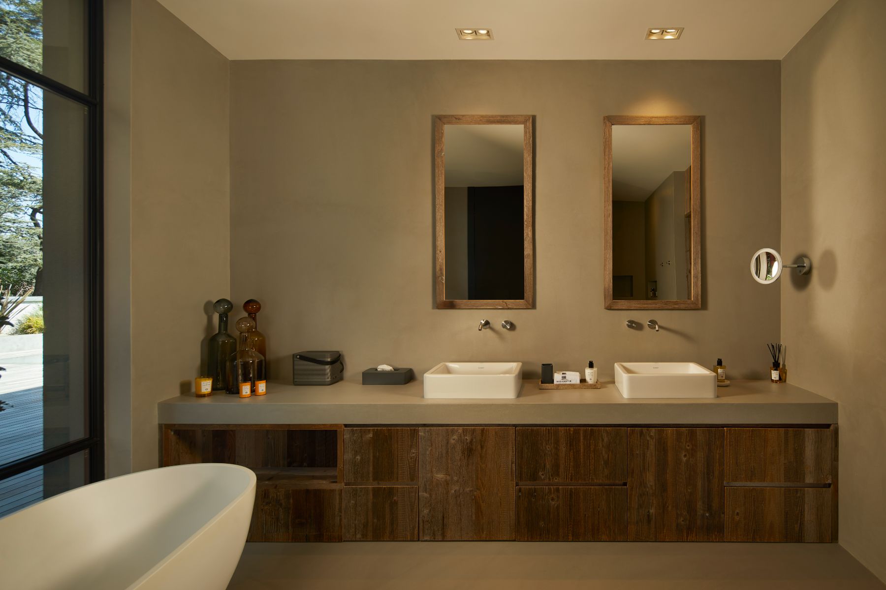Bathroom at Breakwater Griante in Lake Como with view of basins and a two mirrors