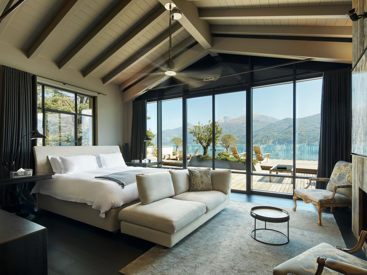 Large bedroom in Breakwater Griante in Lake Como with large french windows opening out to the patio