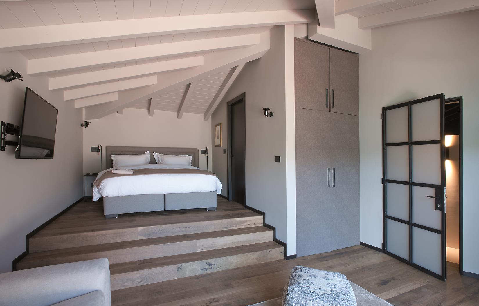 A double bedroom in the Boat House at Lake Como, Italy