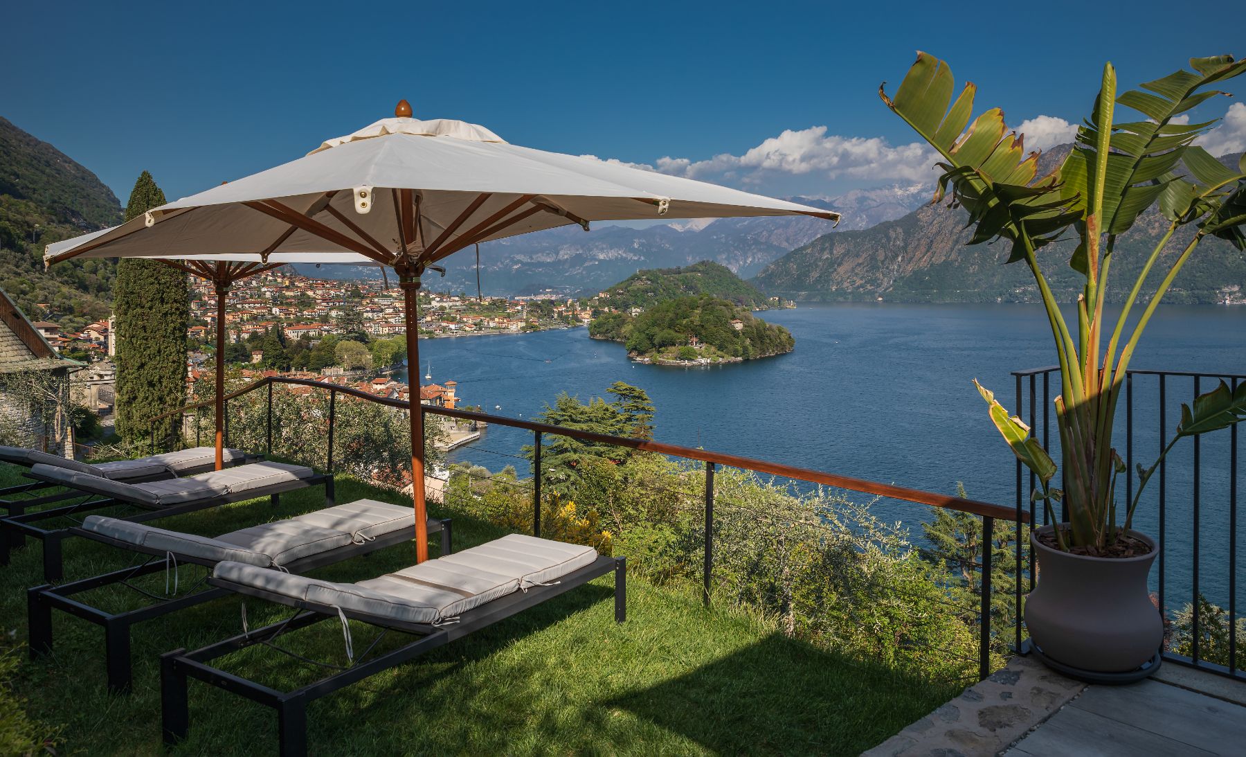 Sun loungers and pool umbrellas at Villa Ardesia in Lake Como