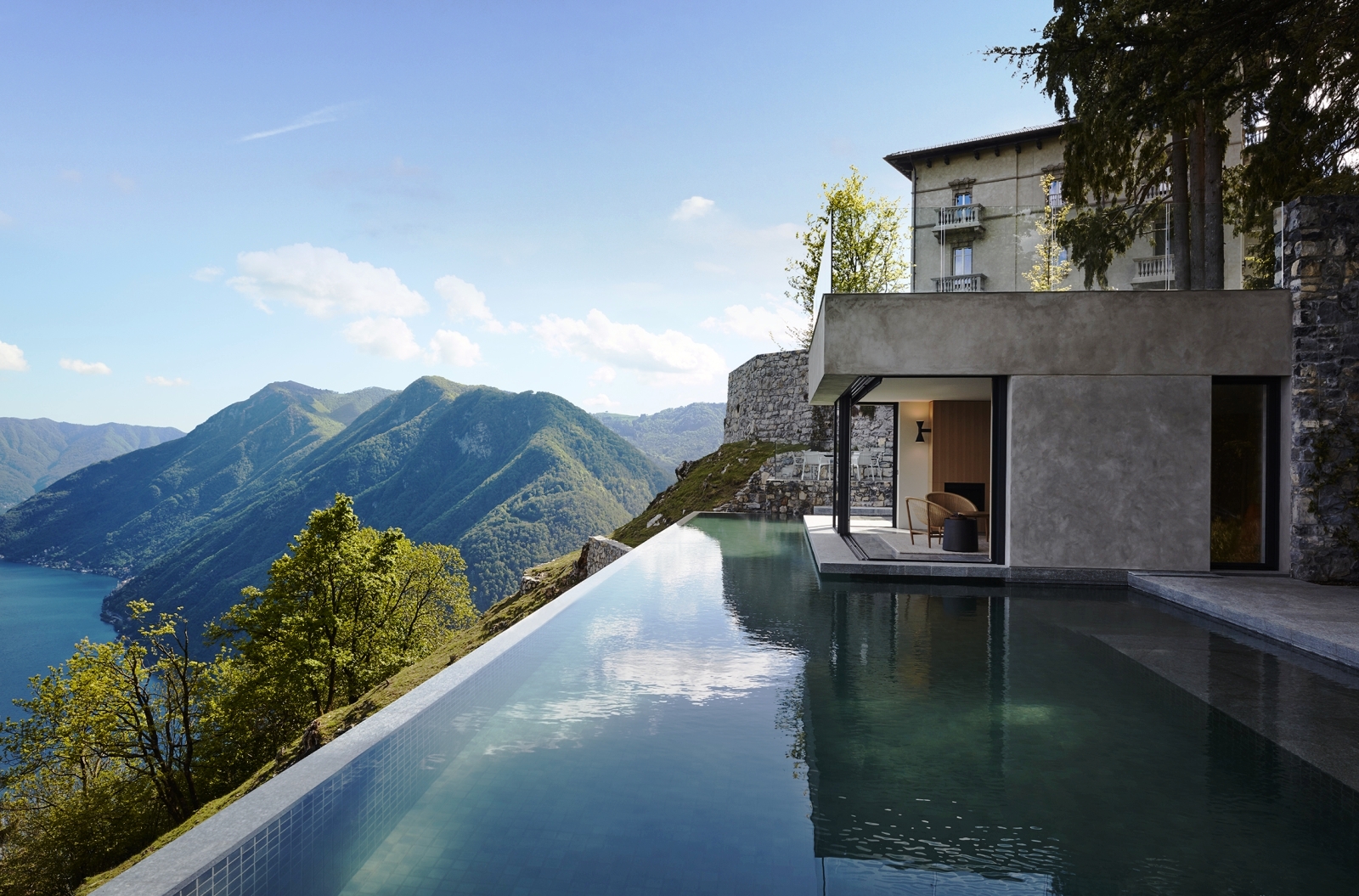 Pool with view of villa, Lake Como and the mountains at Villa della Vetta on Lake Como in Italy