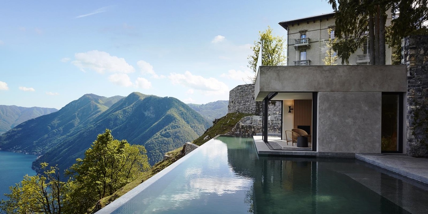 Pool with view of villa, Lake Como and the mountains at Villa della Vetta on Lake Como in Italy