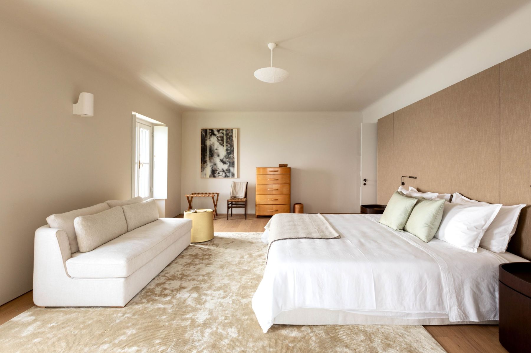 Bedroom with large double bed and white sofa at Villa Della Vetta in Lake Como